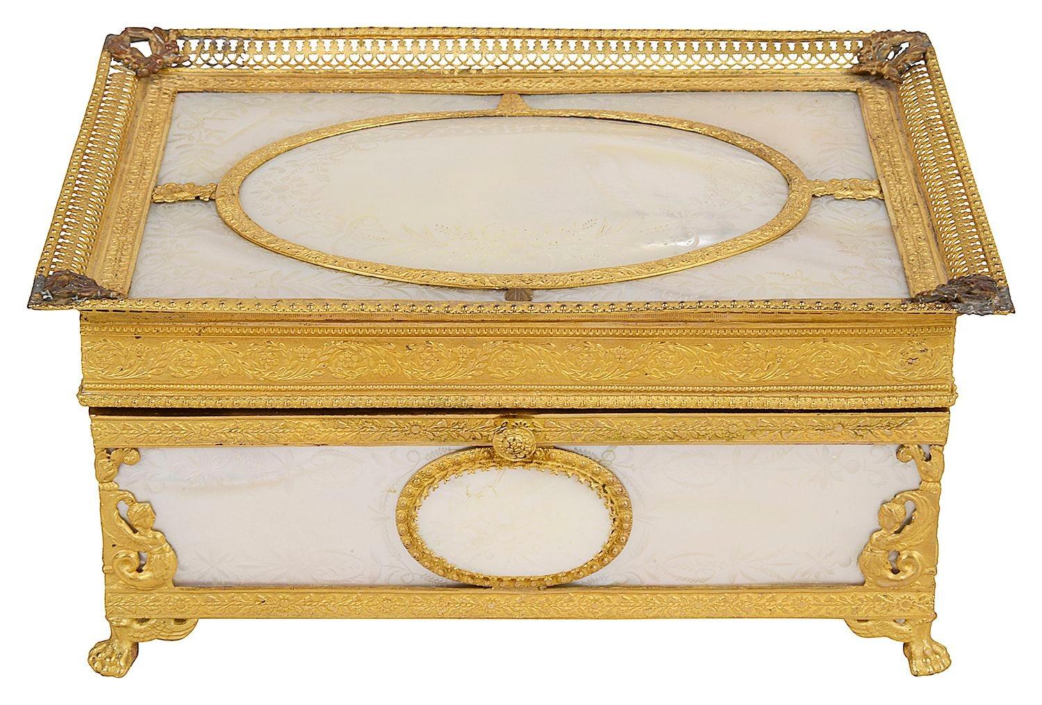 A fine quality 19th century French Palais Royal mother of pearl and ormolu six-bottle perfume casket.
