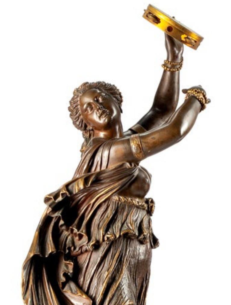 A French patinated bronze figure: The Tambourine Dancer, 19th century, signed J. Clesinger, Rome 1858. Also signed by the foundry F. BARBEDIENNE FONDEUR, two-tone brown patina, together with a bronze-mounted black marble pedestal.
Dimensions: