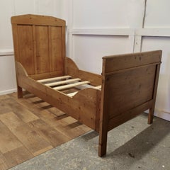 A 19th Century French Rustic Pine Single Sleigh Bed