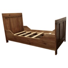 A 19th Century French Rustic Pine Single Sleigh Bed  This is a good solid piece 