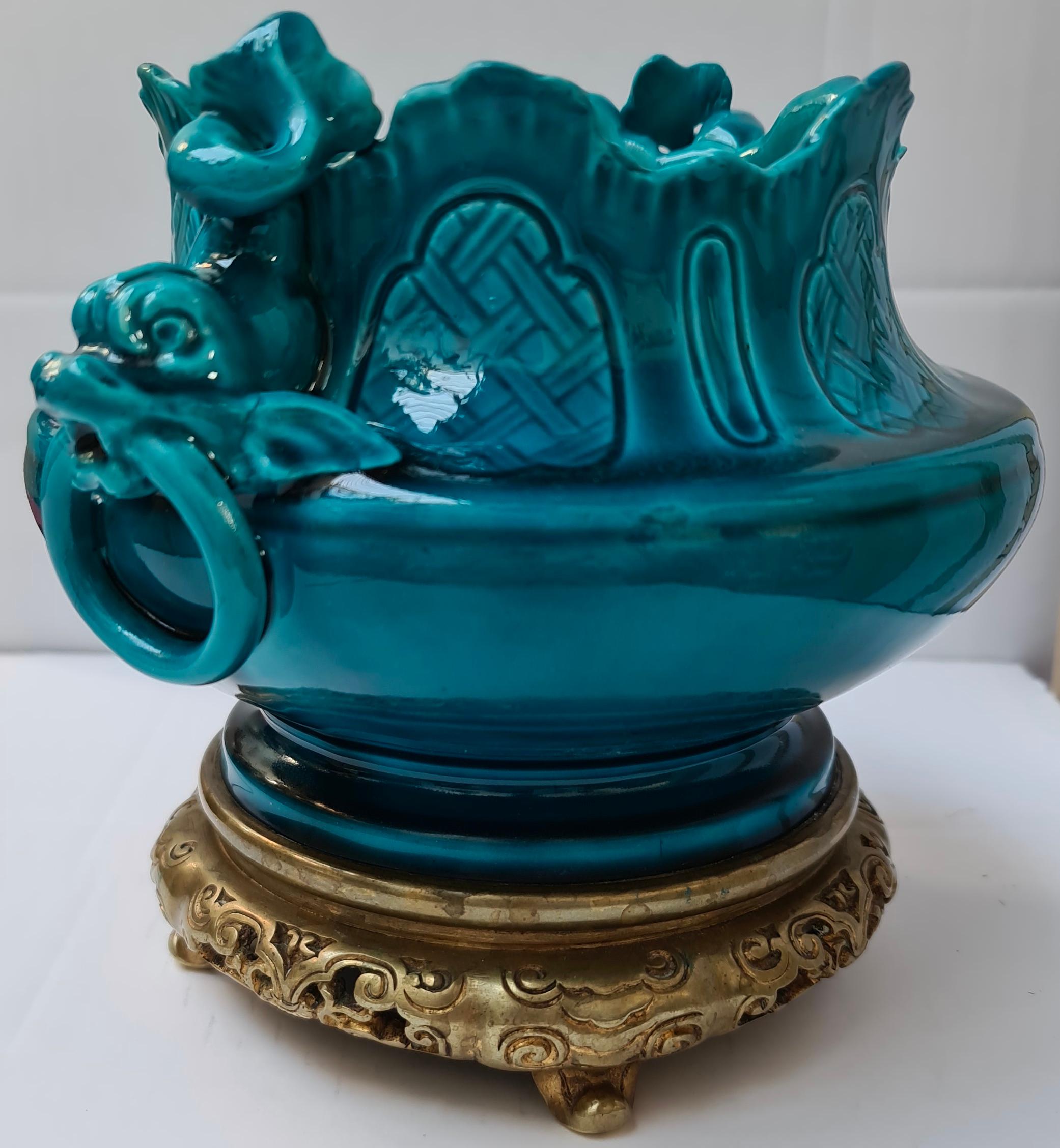 A 19th century French sèvres blue fire glazed porcelain ormolu-mounted center bowl
Applied with two Dolphins simulating handles
Signed underneath,
circa 1880.