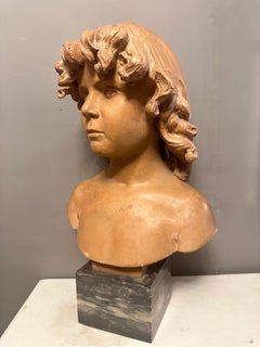 A 19th Century French Terracotta Bust Of A Young Boy
