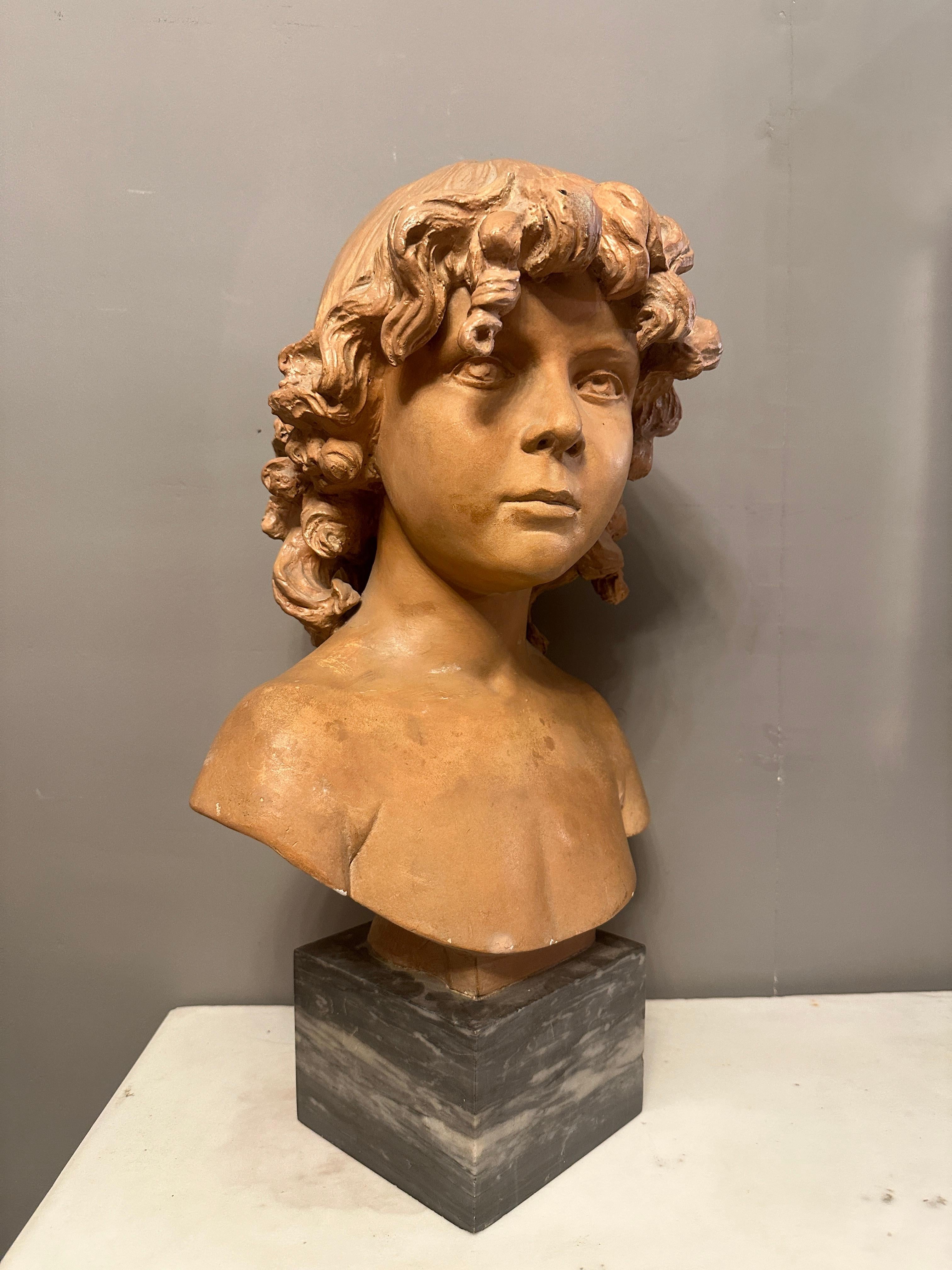 A 19th Century French Terracotta Bust Of A Young Boy For Sale 1