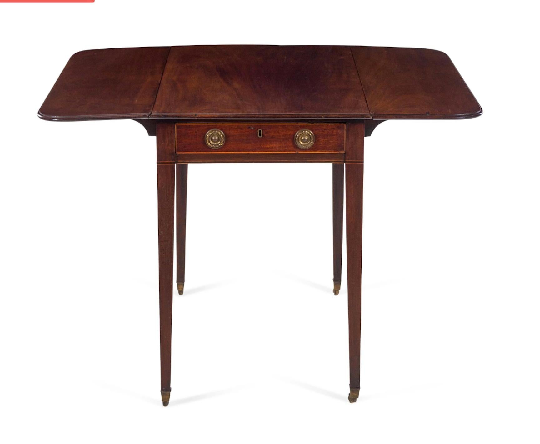A 19th century Geo III mahogany Pembroke table with satin wood inlay.
Measures: Height 27 1/4 x width 19 1/2 (closed) x depth 30 inches.