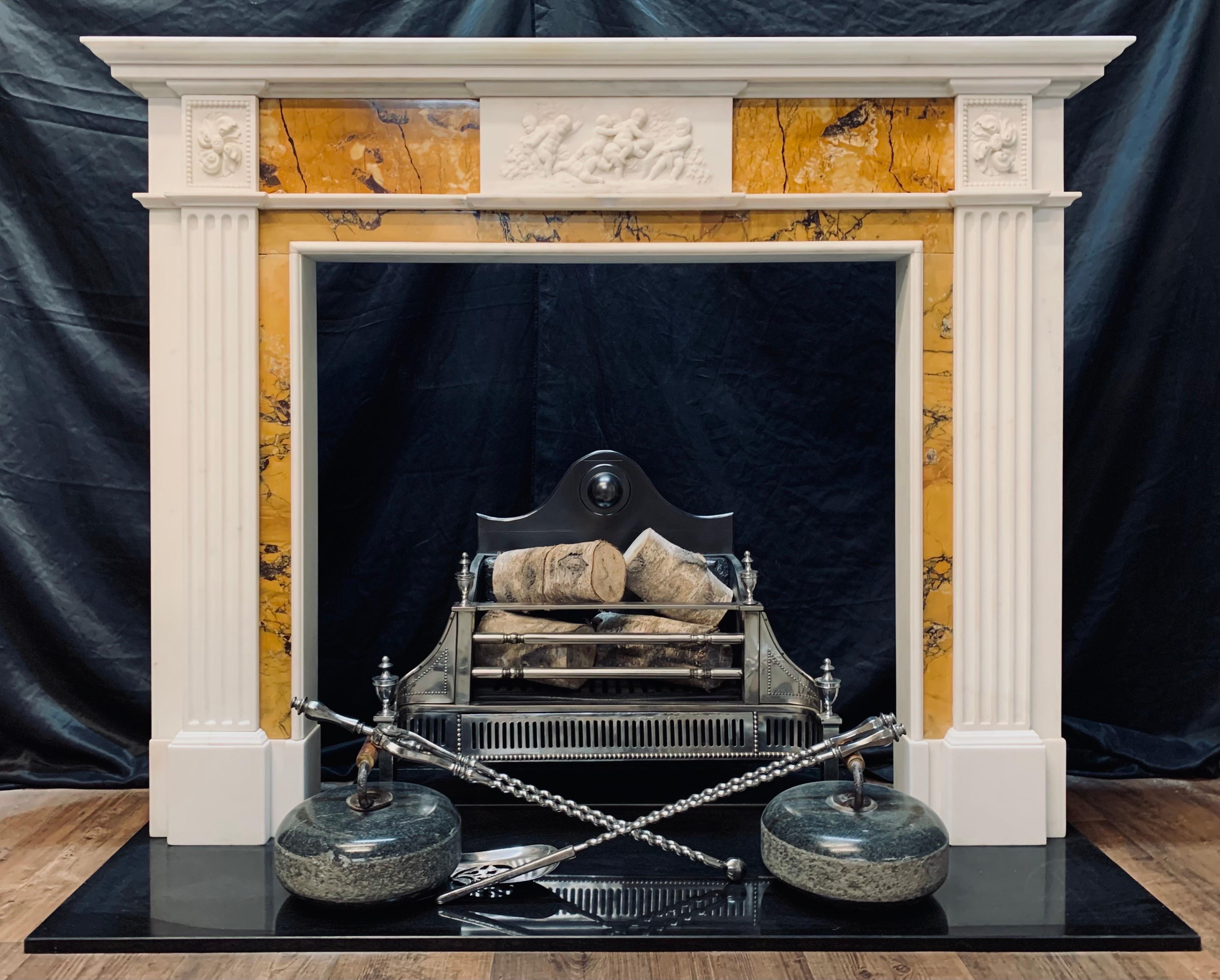 A wonderfully elegant,  late 19th Century Georgian manner statuary & sienna marble fireplace surround. 
An ogee corniced top shelf with a secondary under score shelf sits directly above a corniced moulding that wraps around. Central to this