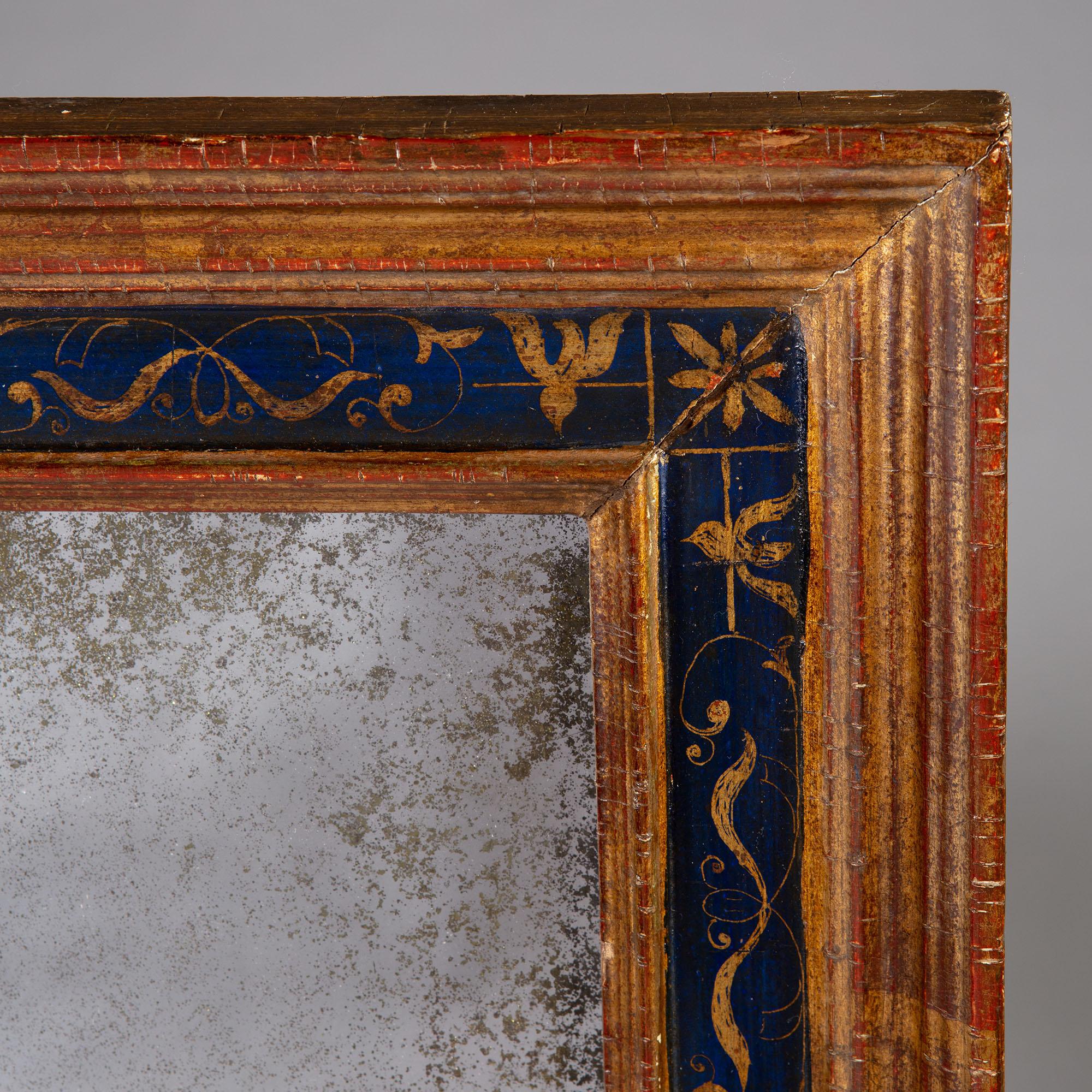 A mid-19th century North Italian mirror, with gilded and blue painted frame, the blue ground decorated with gilt floral motif, with mercury glass mirror plate.