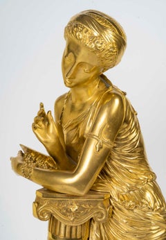 A 19th Century Gilt Bronze Sculpture of a Woman Leaning on a Column.