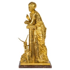 A 19th Century Gilt Bronze Sculpture of a Woman Leaning on a Column.