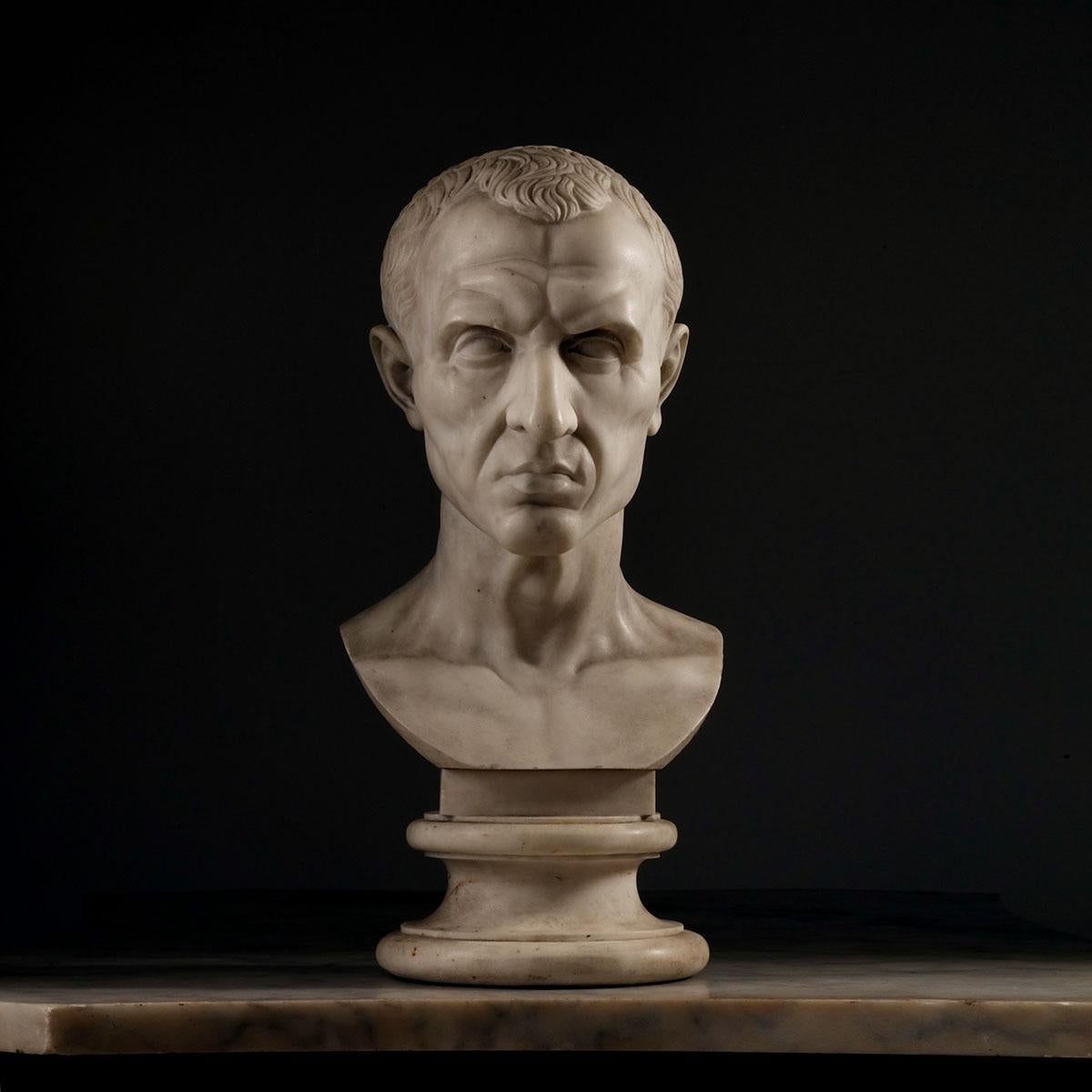 A  19th Century Grand Tour bust of Julius Caesar. 
Carved in pure white fine-grained or statuary marble, long highly prized for its colouration and subtle translucency, renowned as the very finest white marble for sculpture and sourced from the