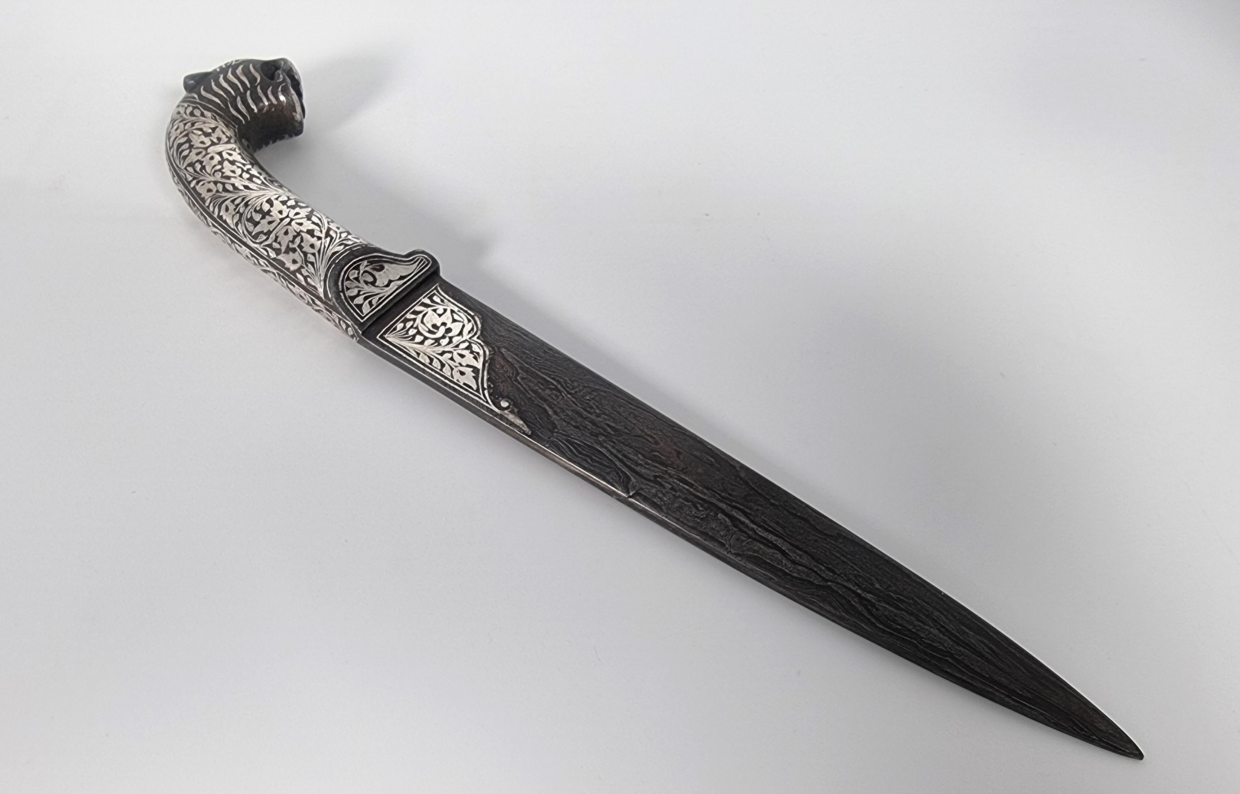 Anglo Raj A 19th century Indian silver inlaid dagger with a Damascus steel blade, C 1870