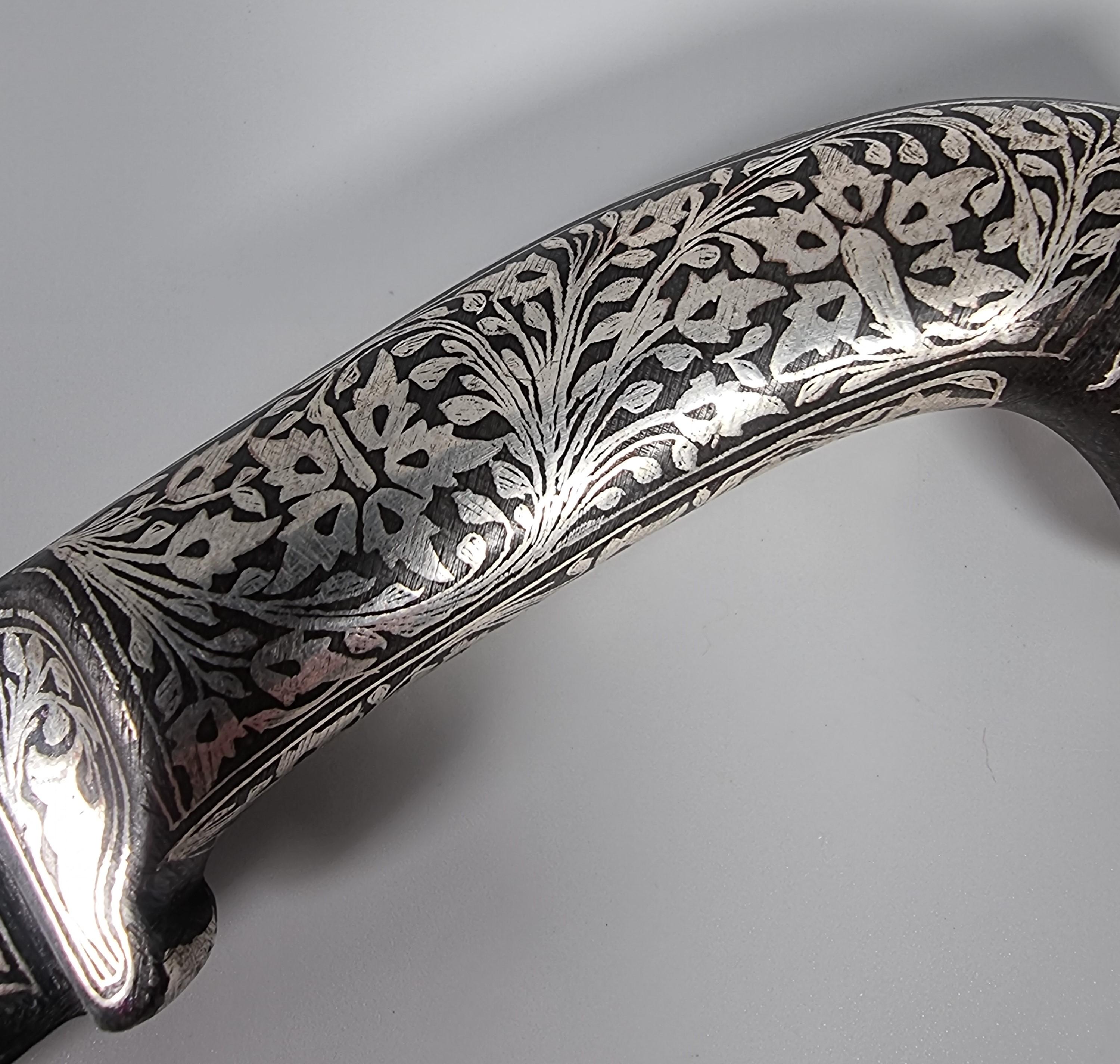 A 19th century Indian silver inlaid dagger with a Damascus steel blade, C 1870 In Good Condition In Central England, GB