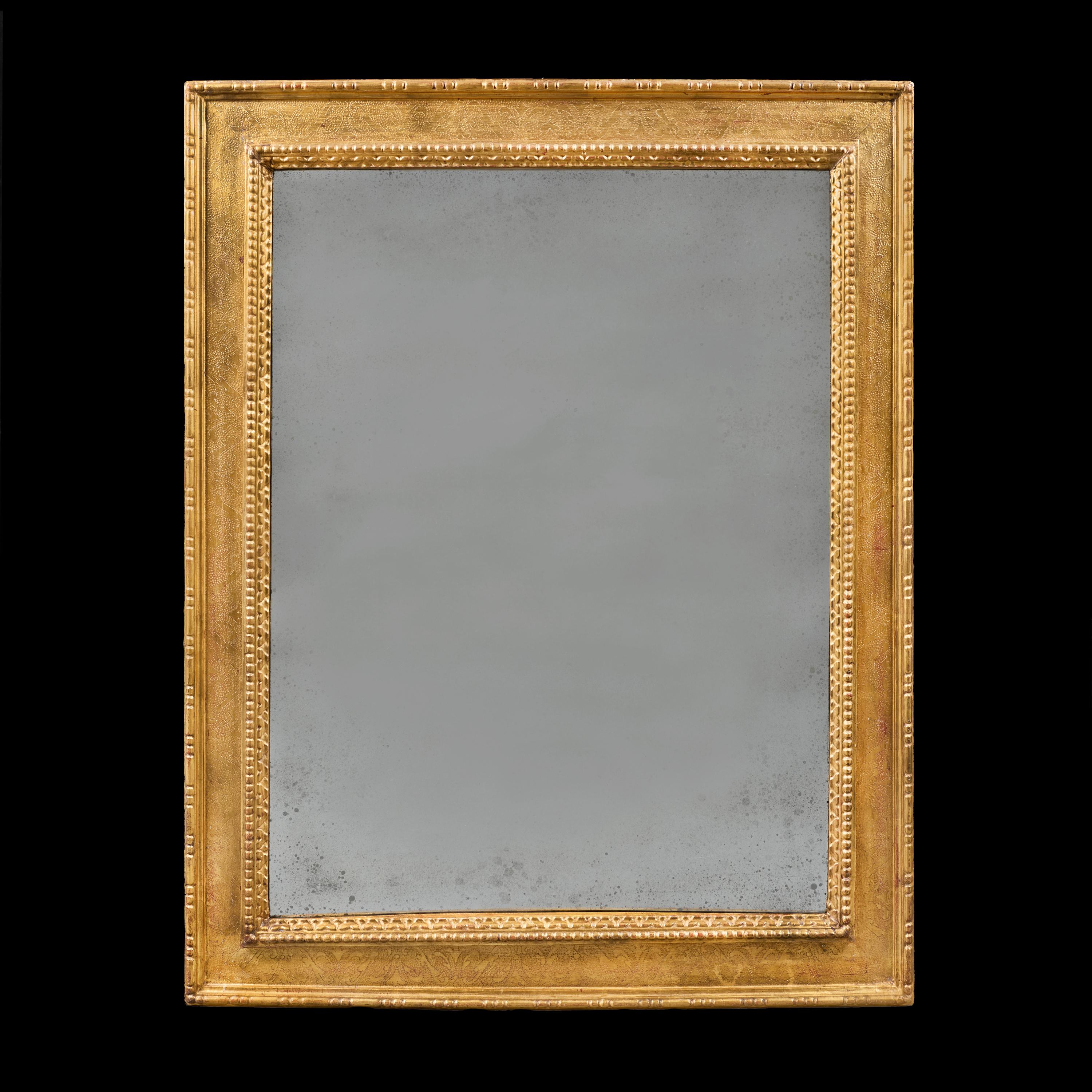 Italy, circa 1860.

A fine mid-nineteenth century gilded mirror, the outer frame with egg and dart moulding, the inner frame decorated with interlocking arabesques with a lightly aged mercury mirror plate.

Height 106.00 centimetres.

Width 84.00
