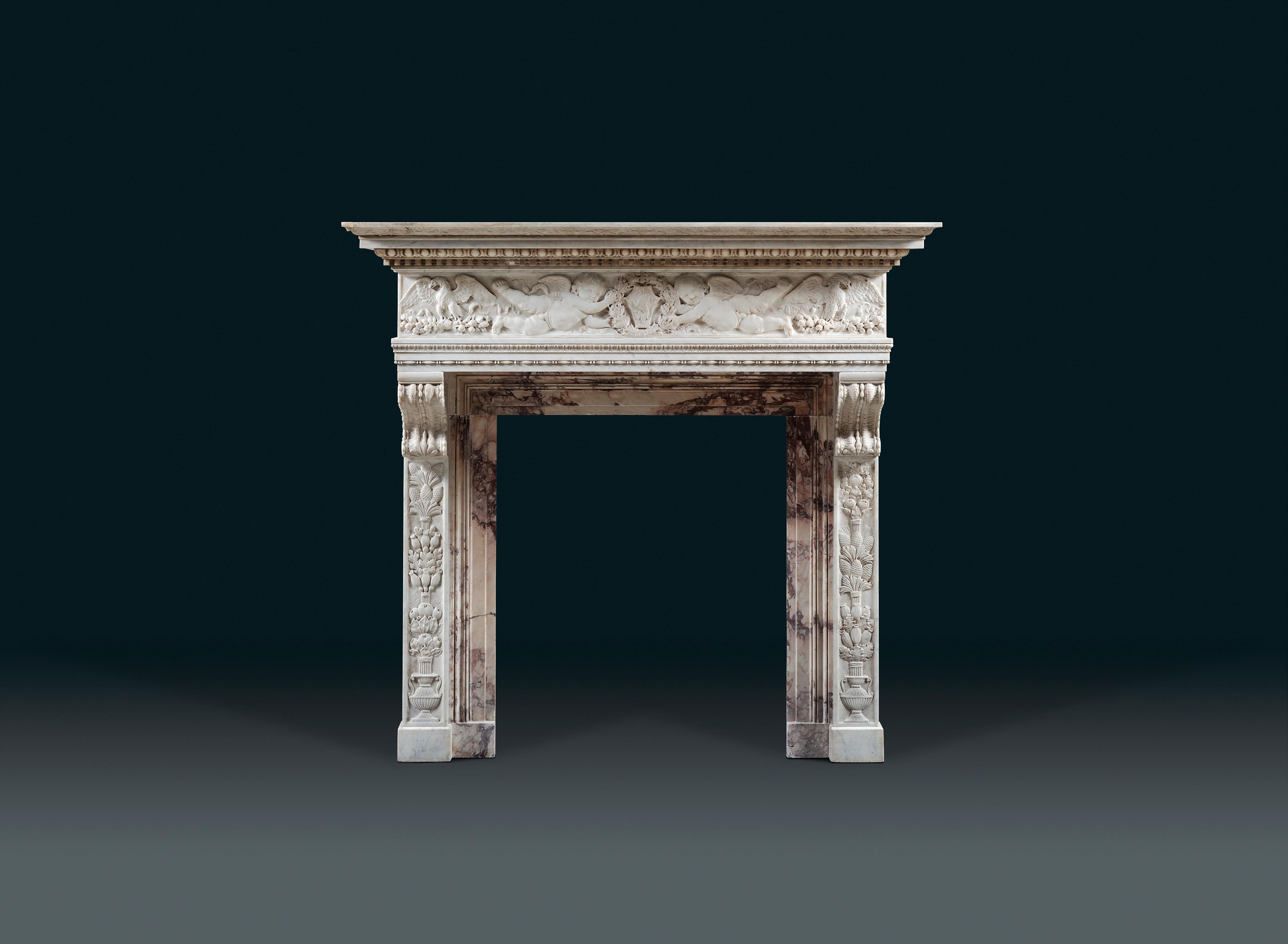 A 19th century Italian statuary and Breche Violette marble chimneypiece, after a 17th century original in Pietra Serena at the Uffizi Gallery, Florence. The cornice shelf is carved with rich egg & dart and dentils, above a running frieze carved in