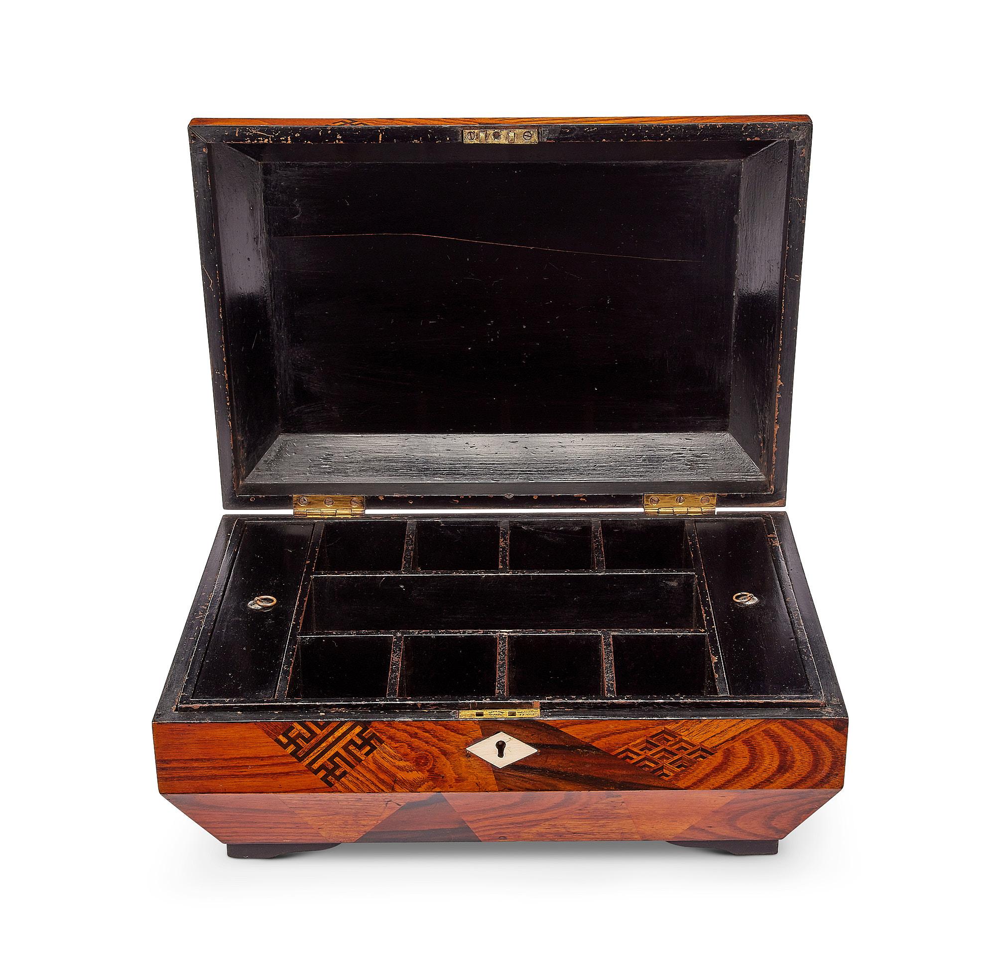 A mid 19th century Japanese export elm and calamander parquetry workbox with a divided interior and lift out tray.

This charming box would work either as a jewllery or workbox, the interior comprises a lift out tray divided with eight small