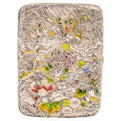 A 19th century Japanese Meiji Silver And Enamel Floral Cigarette Case
