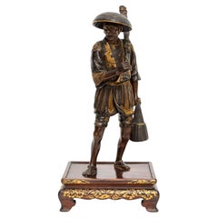 Antique A 19th Century Japanese Patinated and Gilt Bronze Model of a Fisherman, by Miyao