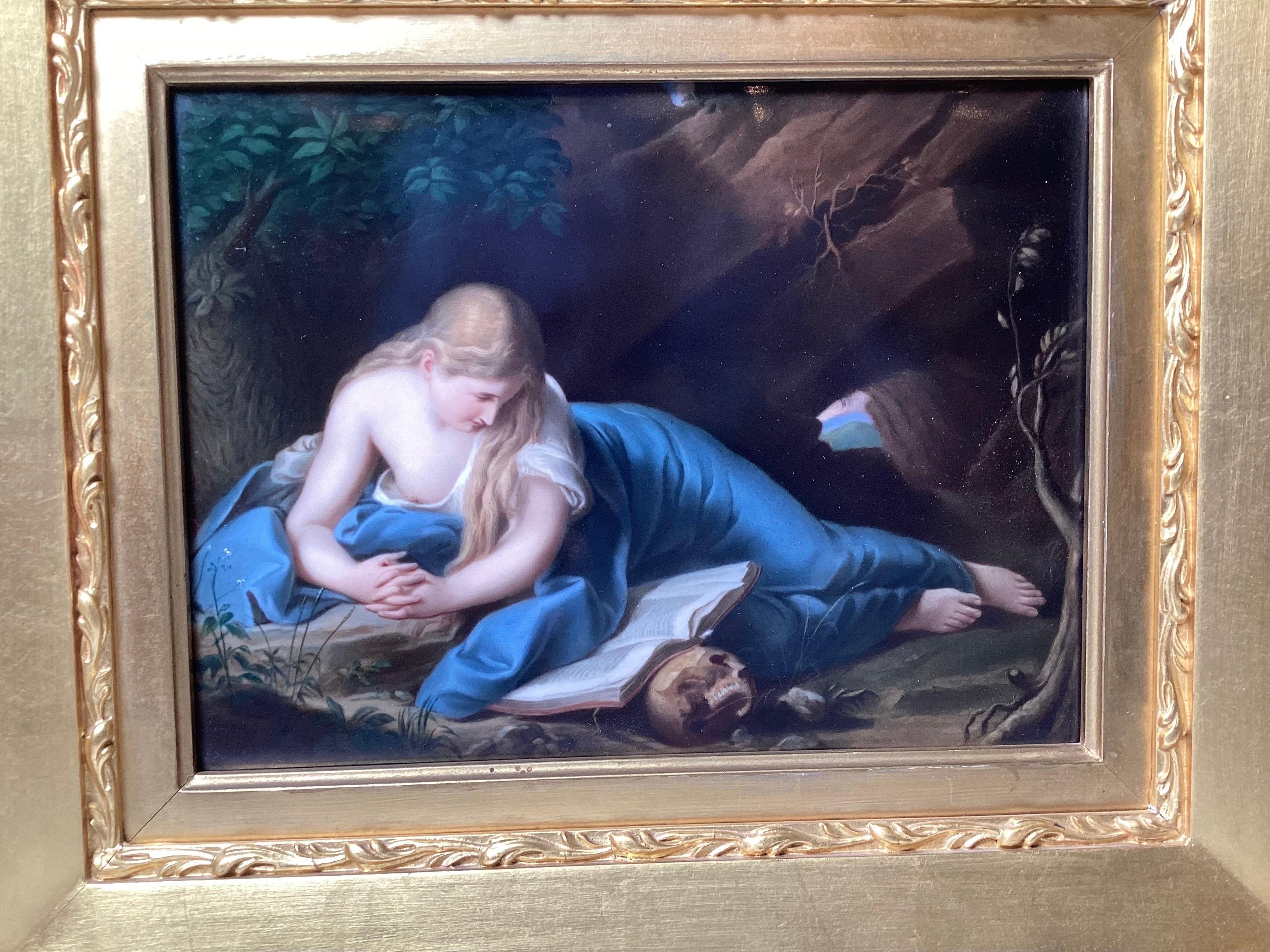 A beautifully painted porcelain plaque in original giltwood frame.  The image of Mary Magdalene after the original Italian artist, Pompeo Batoni.  The measurements framed are 16 inches wide, 18 inches high, 3.5 inches deep 
