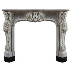 A 19th century, Louis XV style Statuary marble rococo chimneypiece
