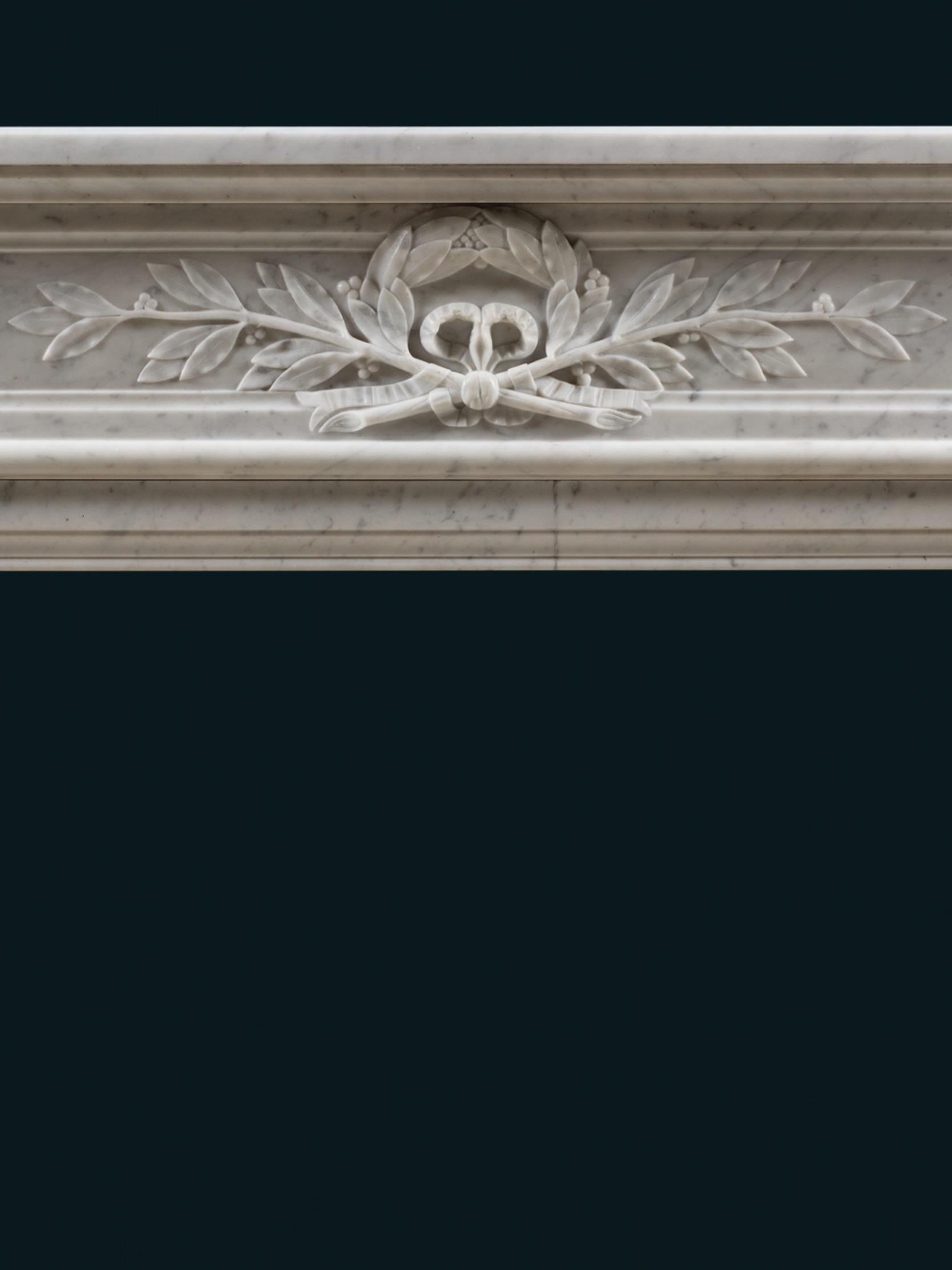 Hand-Carved A 19th Century Louis XVI Style Chimneypiece in Carrara Marble For Sale