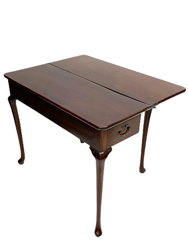 A 19th century mahogany console/ folding table

A 19th century mahogany folding table with cabriole legs and a drawer on each side. The table can be used as a console against the wall. The 2 rear legs can be unfolded, on which the top can be