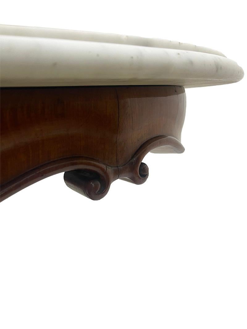 Marble A 19th Century mahogany table with a cartouche-shaped marble top, ca 1840 For Sale