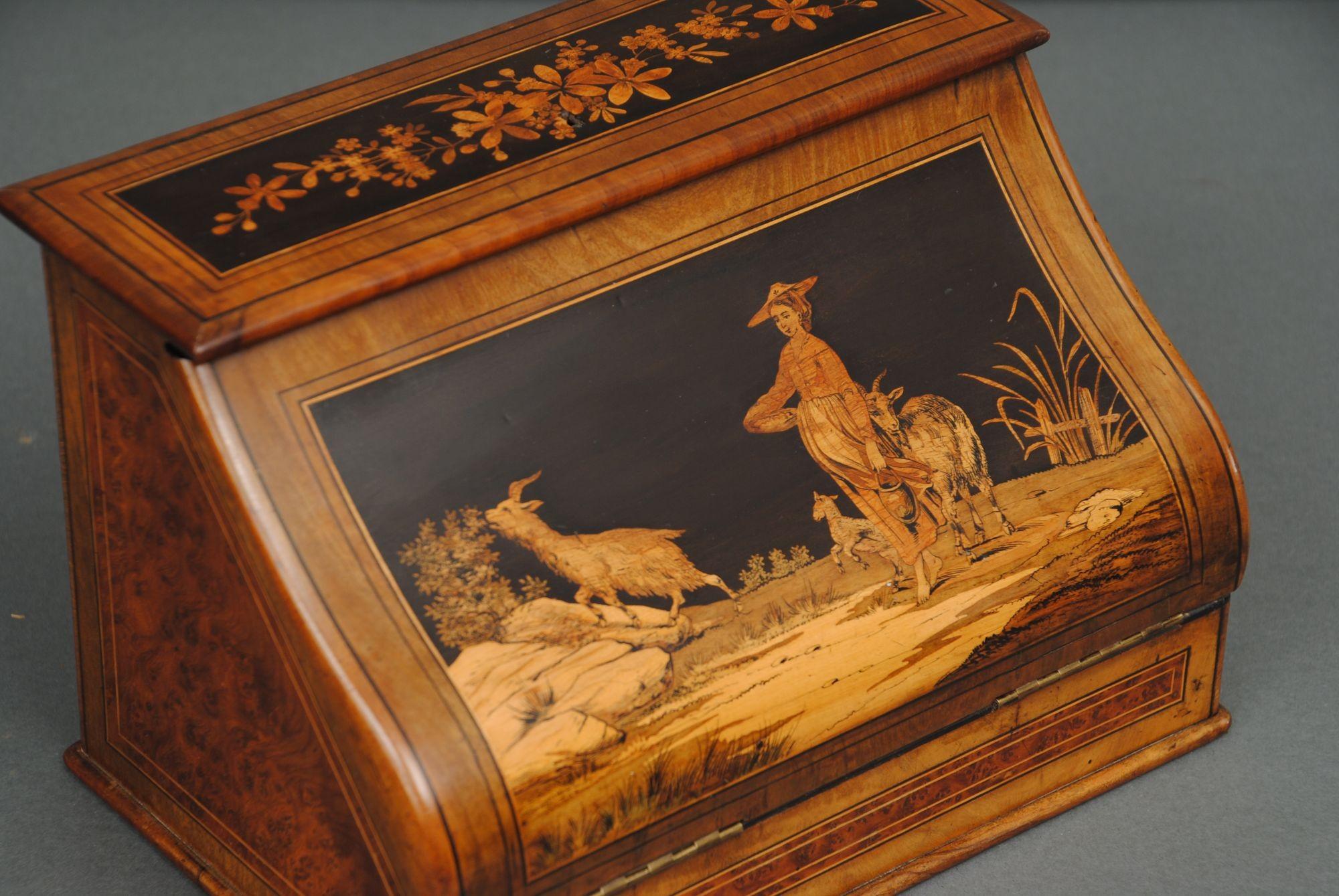 A fine quality marquetry inlaid walnut and olive wood Italian letter or paper box, the shaped top lid with a pastoral scene and shepherdess. 
Circa 1870