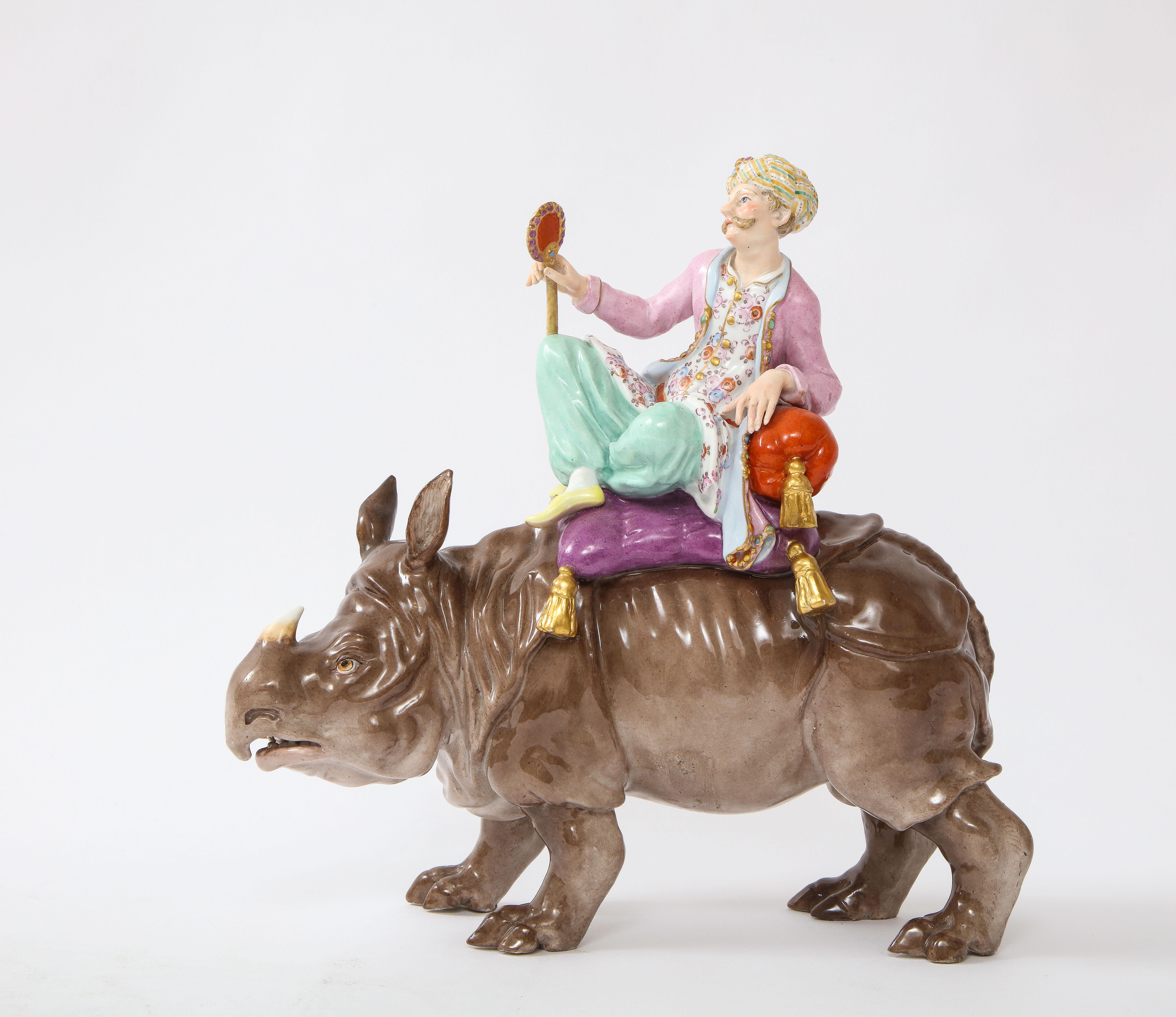 A fantastic 19th century Meissen Porcelain orientalist/Turkish figure of a Malabar Man seated on a rhinoceros. This is a rare and beautiful group made by Meissen in the 1800's of a Malabar, after the original model by J.J. KÄNDLER and Friedrich