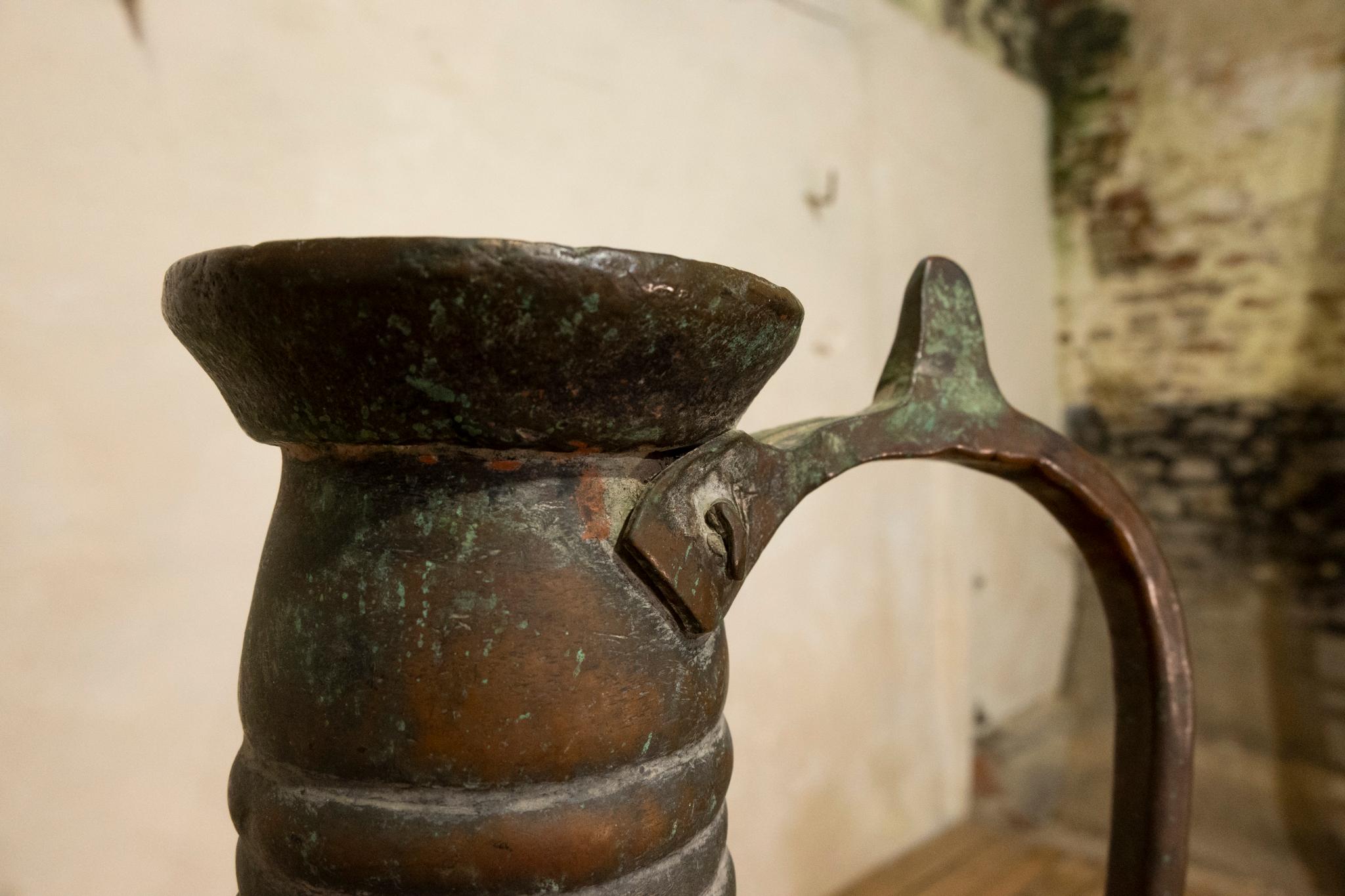 A large highly decorative middle eastern copper ewer. Dating from the early 19th century, displaying a charming patination throughout. 

Measures: Height - 50cm 
Width - 30cm 
Depth - 35cm.