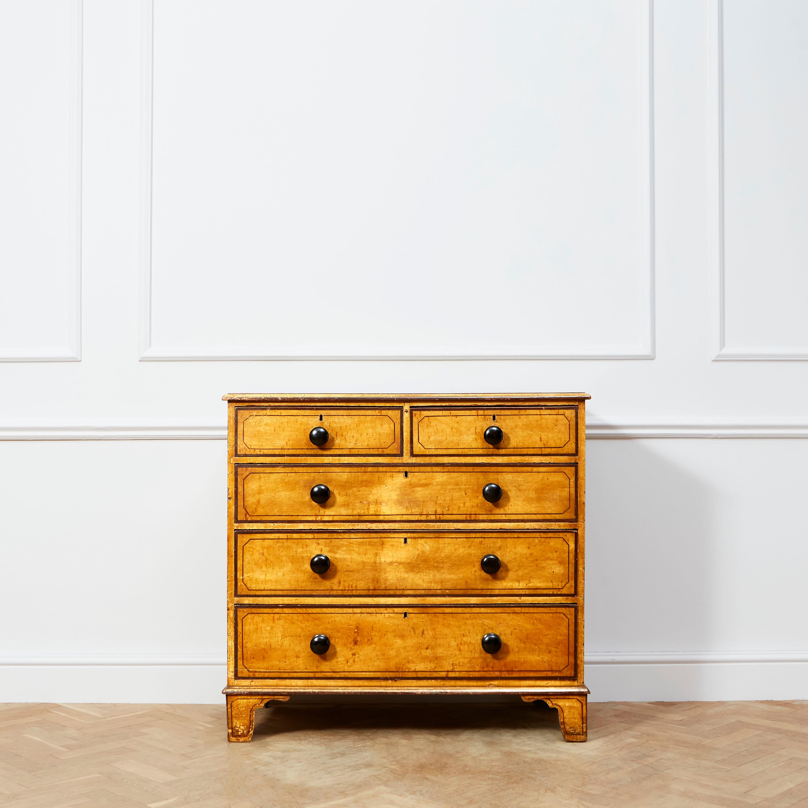 An early nineteenth century painted pine chest of drawers, wonderfully proportioned and in excellent serviceable condition.

English, early nineteenth century