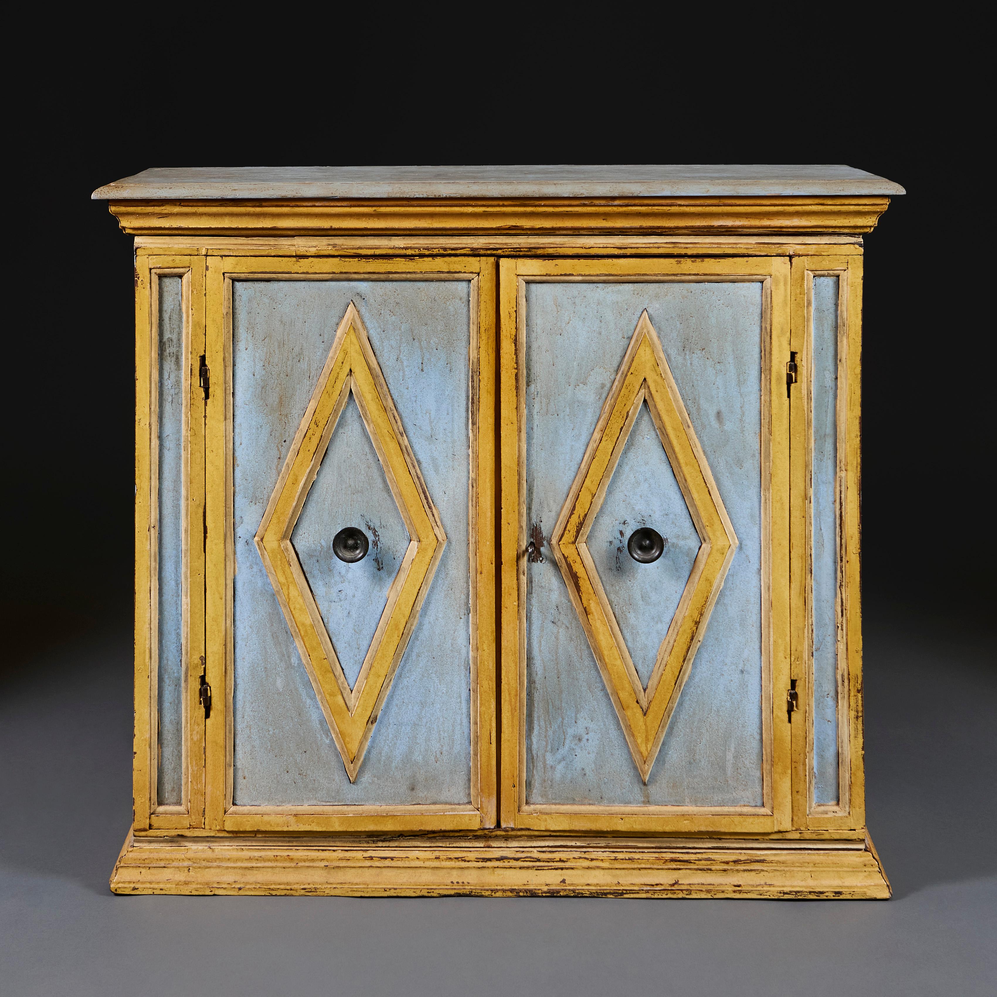 Italy, circa 1860

A mid nineteenth century painted side cabinet with cornice and plinth, the door applied with diamond decoration and the interior revealing a single shelf.

Height 95.00cm
Width 107.00cm
Depth 40.00cm.