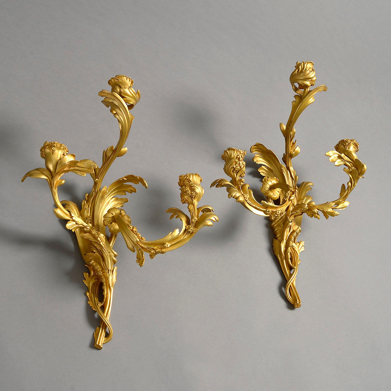 Exceptionally well modelled, each naturalistically formed with three-branches with lamp holders, formed from leaves and flowers. Wired for electricity

A set of four wall lights of the same model signed ‘Henri Dasson’ sold Christie’s London, South