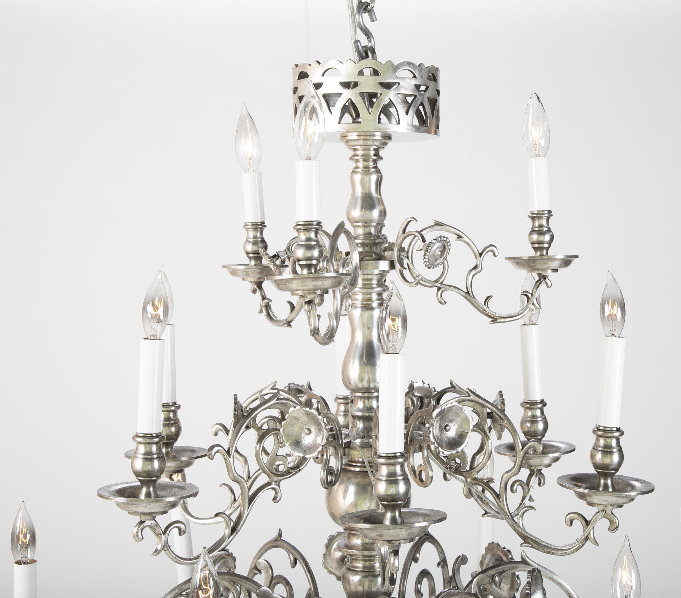 A 19th century polished iron 14 light three-tier chandelier.