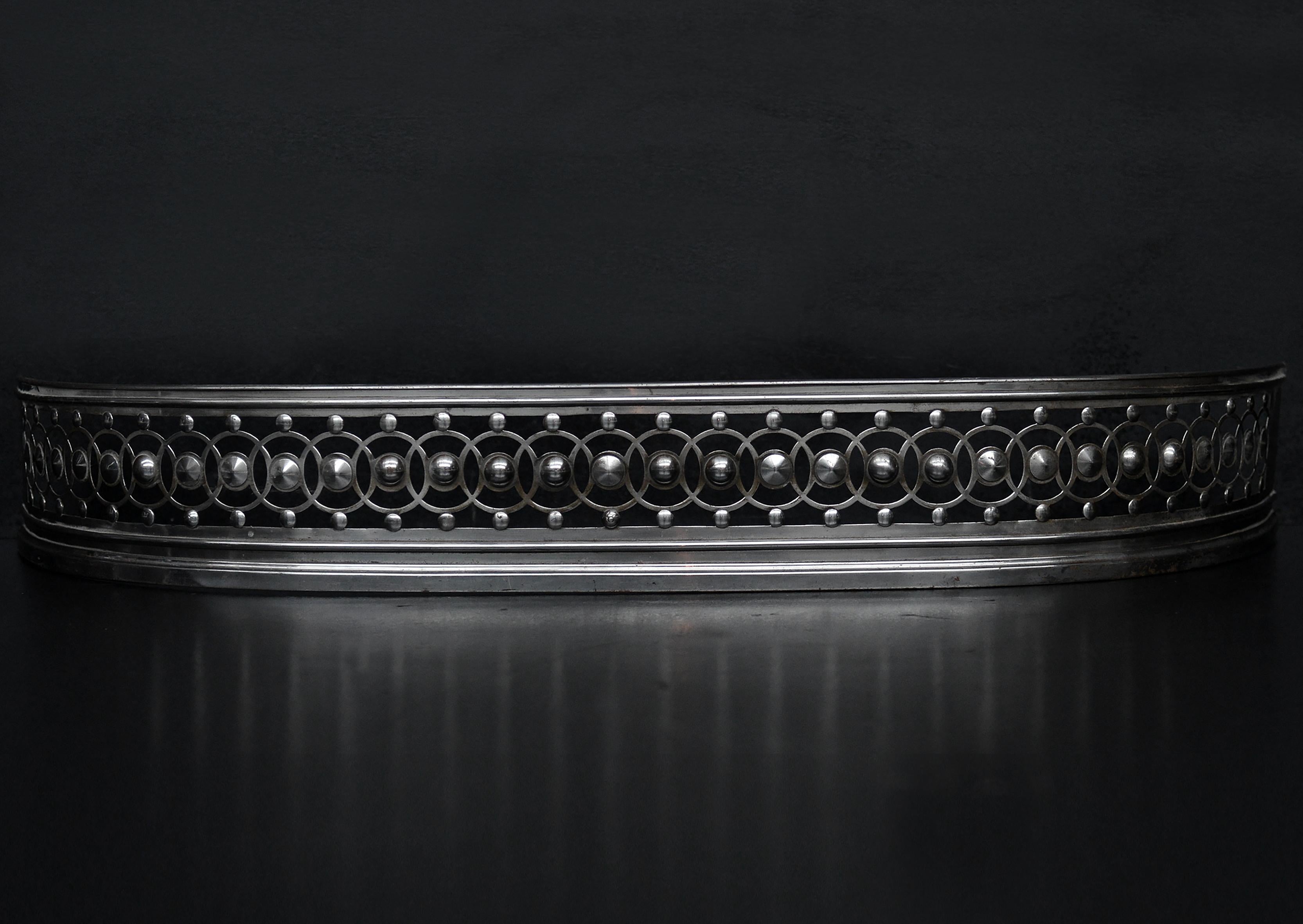 A 19th century polished steel fender with guilloche pattern throughout. Georgian style.

External Width:	1168 mm      	46