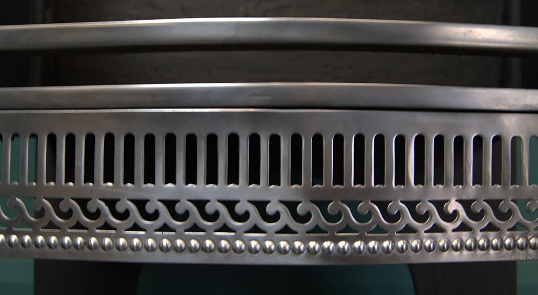 English A 19th Century Polished Steel Fire Grate For Sale