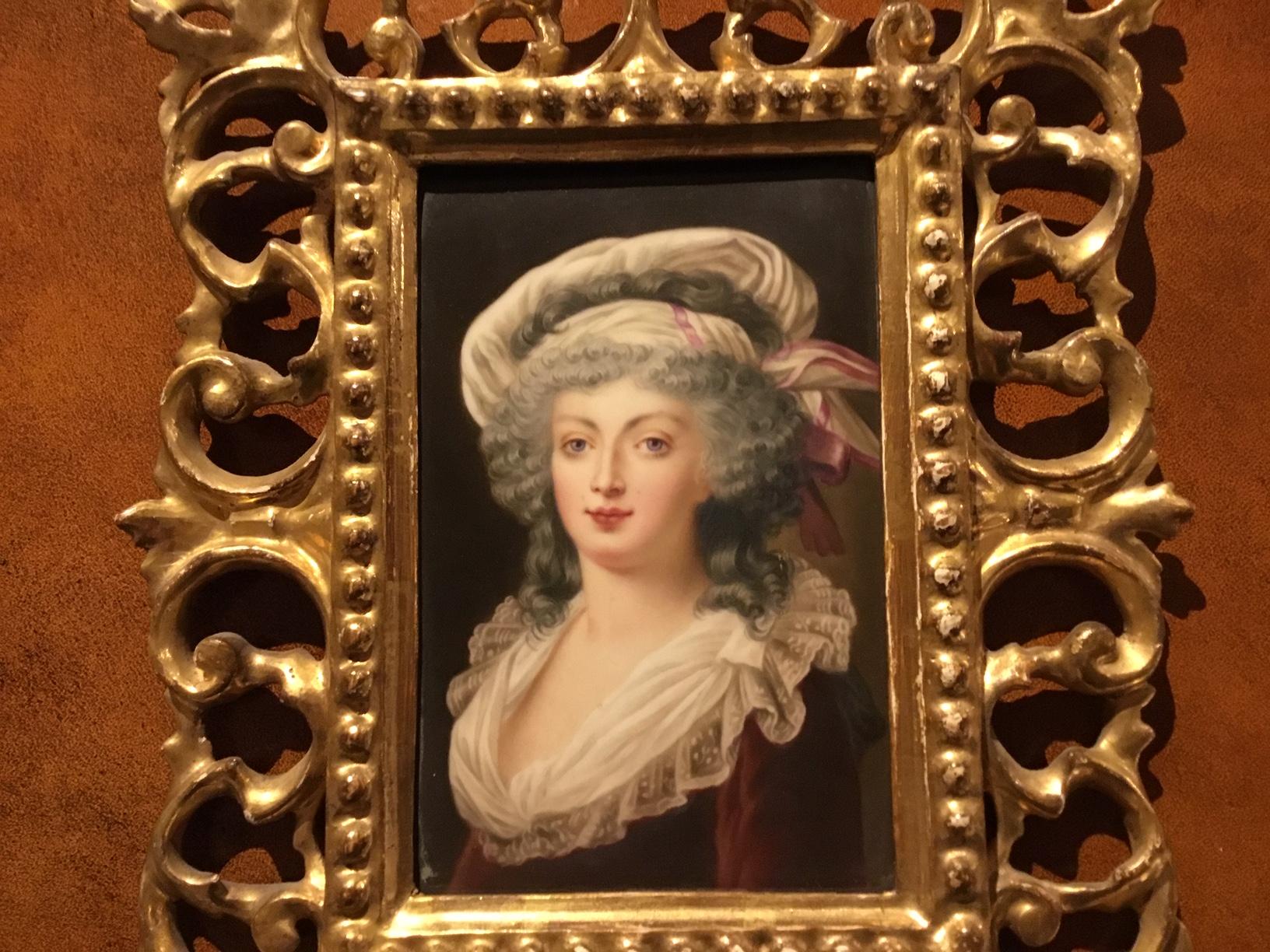 A 19th century porcelain plaque depicting a portrait of an attractive lady, housed within an ornate carved Florentine giltwood frame, Austrian, circa 1880

Dimensions: 8