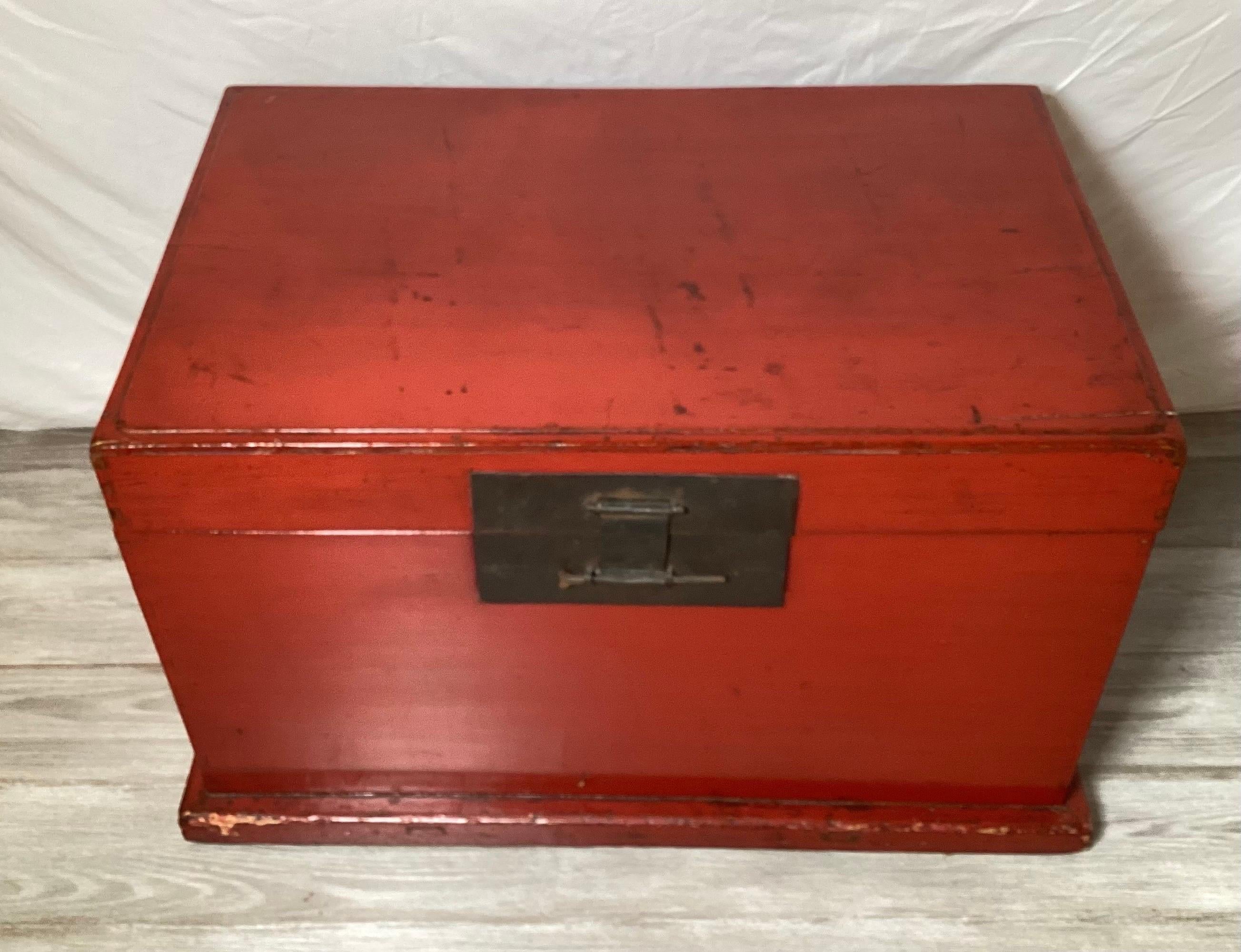 An Antique 1880's Chinese red lacquer trunk with brass mounts.  The original lacquer finish with signs of age and use.  Great original condition, the inside bottom with an age separation, still functional and decorative 