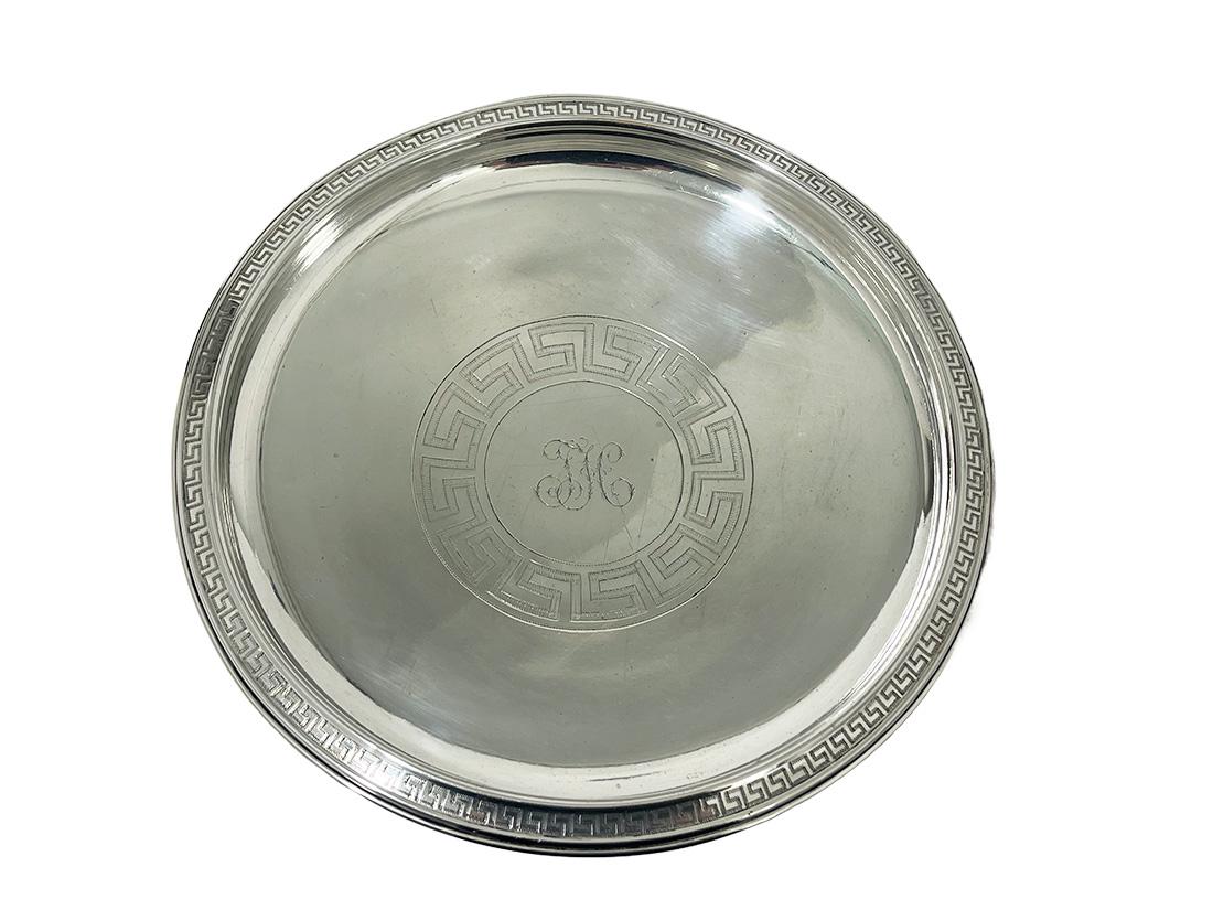 A 19th Century round silver footed bowl

A silver bowl on foot with an Ancient Greek Key pattern on the curved rim. In the center a Greek Key pattern circle with initials engraved. It is Dutch hall marked with the Dutch old tax mark for old large