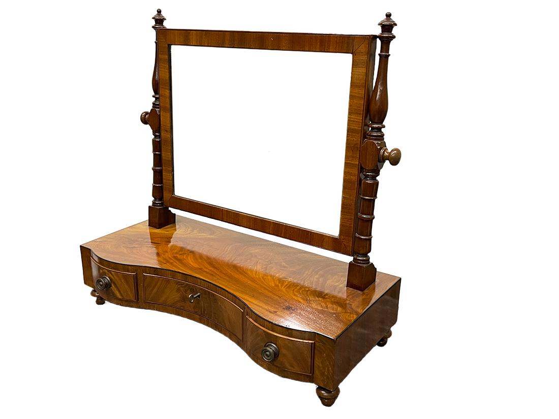 A 19th Century Scottish dressing table with mirror by Jack, Paterson & Co.

A Mahogany curved dressing table with tilting mirror by
Jack, Paterson, & Co. Cabinet makers & upholsterers, Trongate, Glascow, Scotland
Marked with the label of Jack,