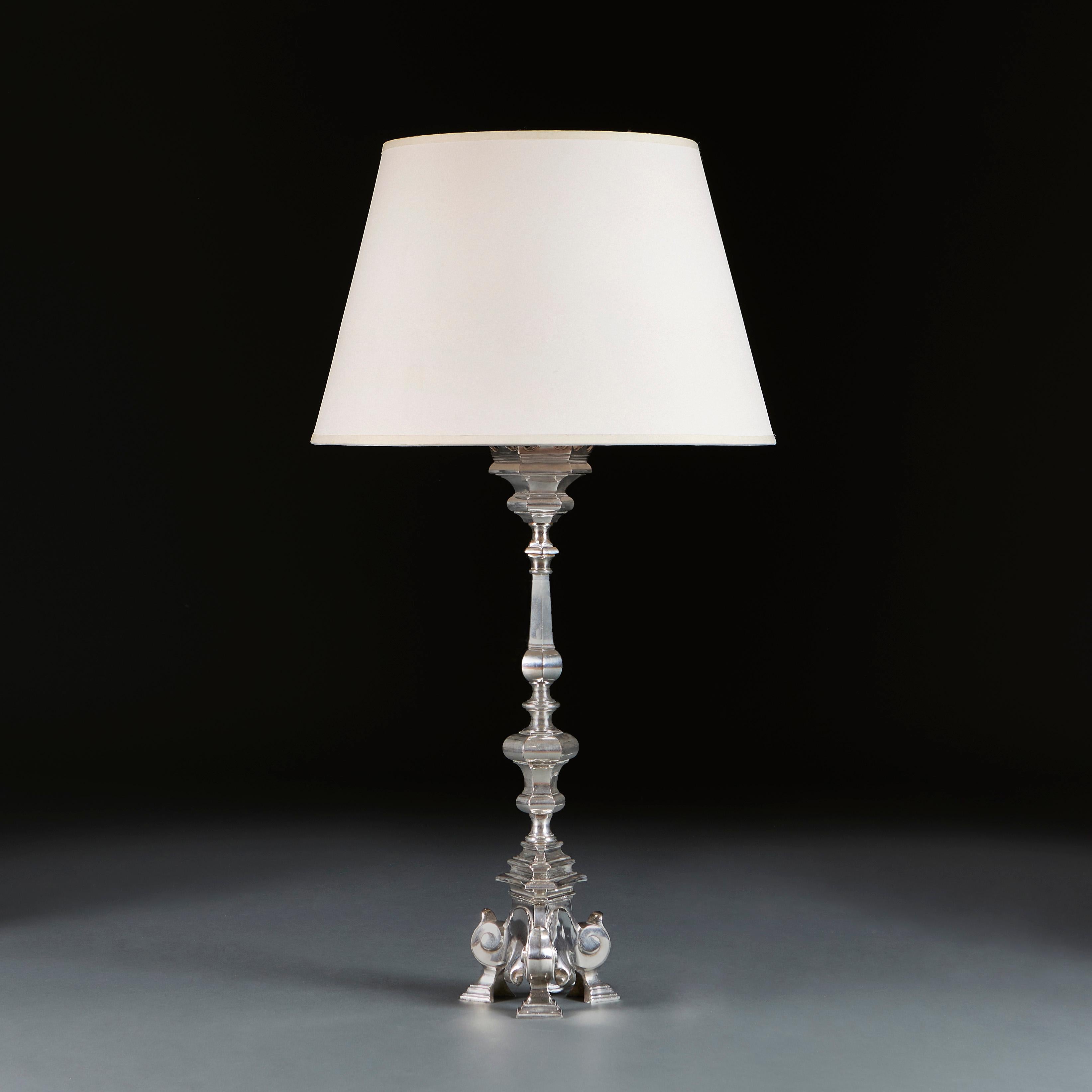 France, circa 1890

A late nineteenth century French silver column lamp of large scale, with coronet rim, baluster stem and supported on a tripod base.

Height 56.00cm
Height with shade 81.00cm
Width of base 16.00cm.

Please note: This is currently