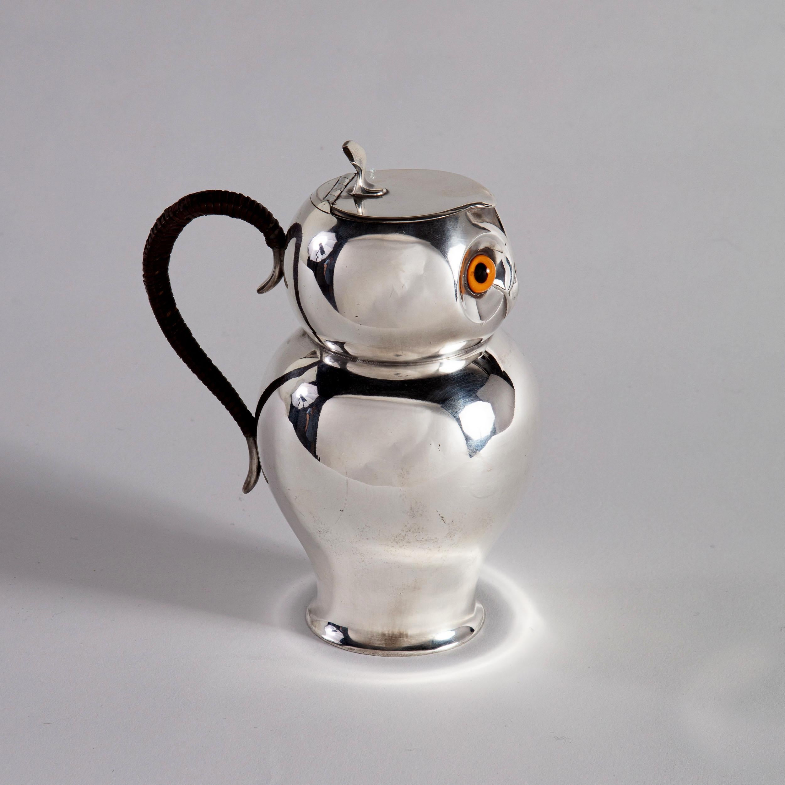 A rare late 19th century silver plated hot chocolate pot in the form of an owl, with the original glass eyes and brown wicker handle.
Stamped to the base with makers mark: Crestwick & Co, Sheffield, circa 1880.
Made for the retailers HJ LINTON, 30