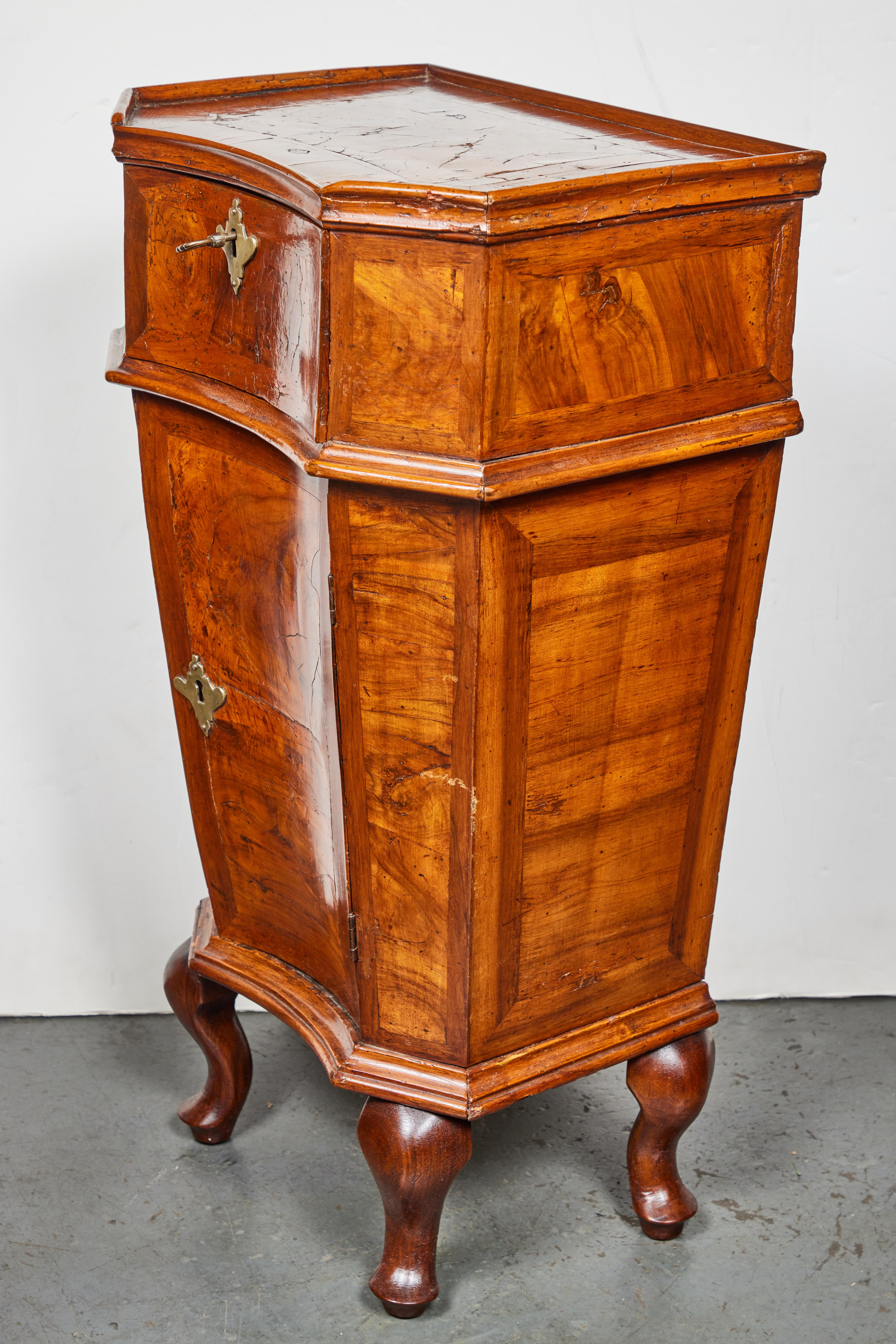 Wonderful, single drawer, one-door, tapered, hand-carved Venetian commode. The whole in walnut, with inlay and veneering. The piece is banded in three parts and sits on charming, petite, cabriole legs. The back initialed 