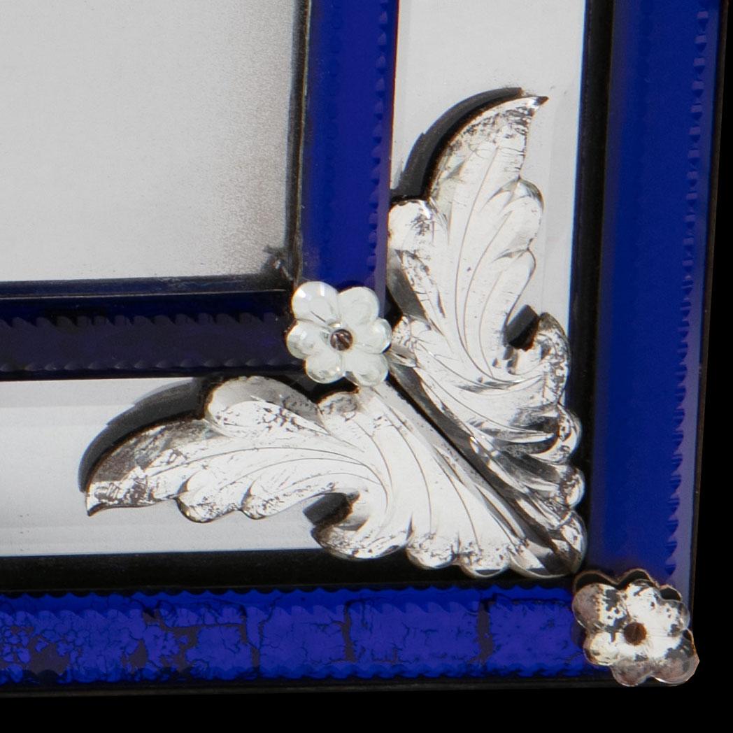 A fine late 19th century rectangular mirror with bevelled mercury plate and blue glass borders, decorated with paterae and finely cut glass brackets.