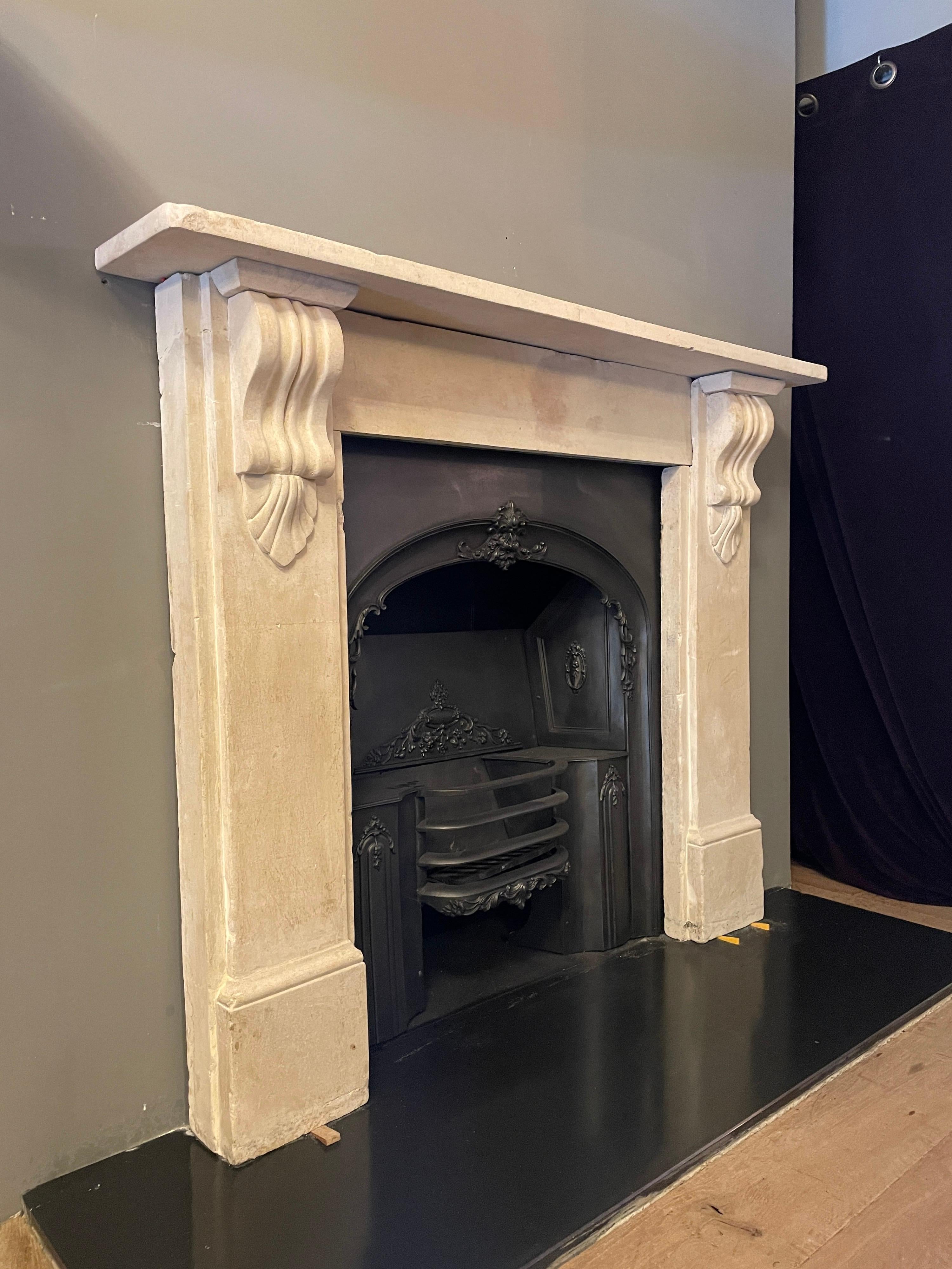 A typical Victorian style fireplace in English Bathstone, with plain jambs and frieze and carved corbel brackets with shell decoration. Gently restored to retain its rusticity

English, Circa 1880 

Opening size :

79cm W x 95cm H.