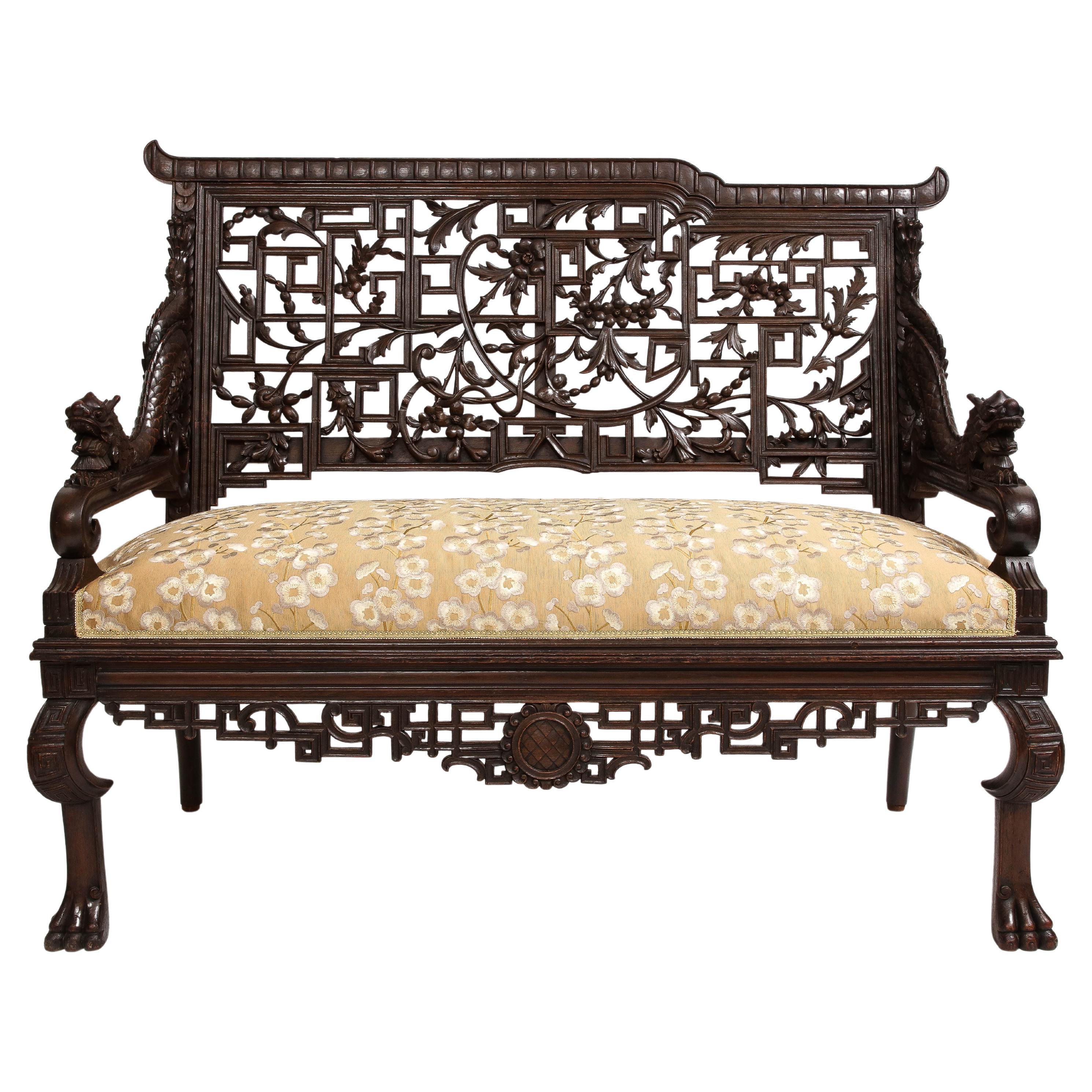 An Incredible 19th Century French Hardwood Japanism Sofa, by Gabriel Viardot. The backrest of this exceptional sofa is adorned with a stunning display of carved open fret-work designs, masterfully intertwined with delicate scrolls and foliate