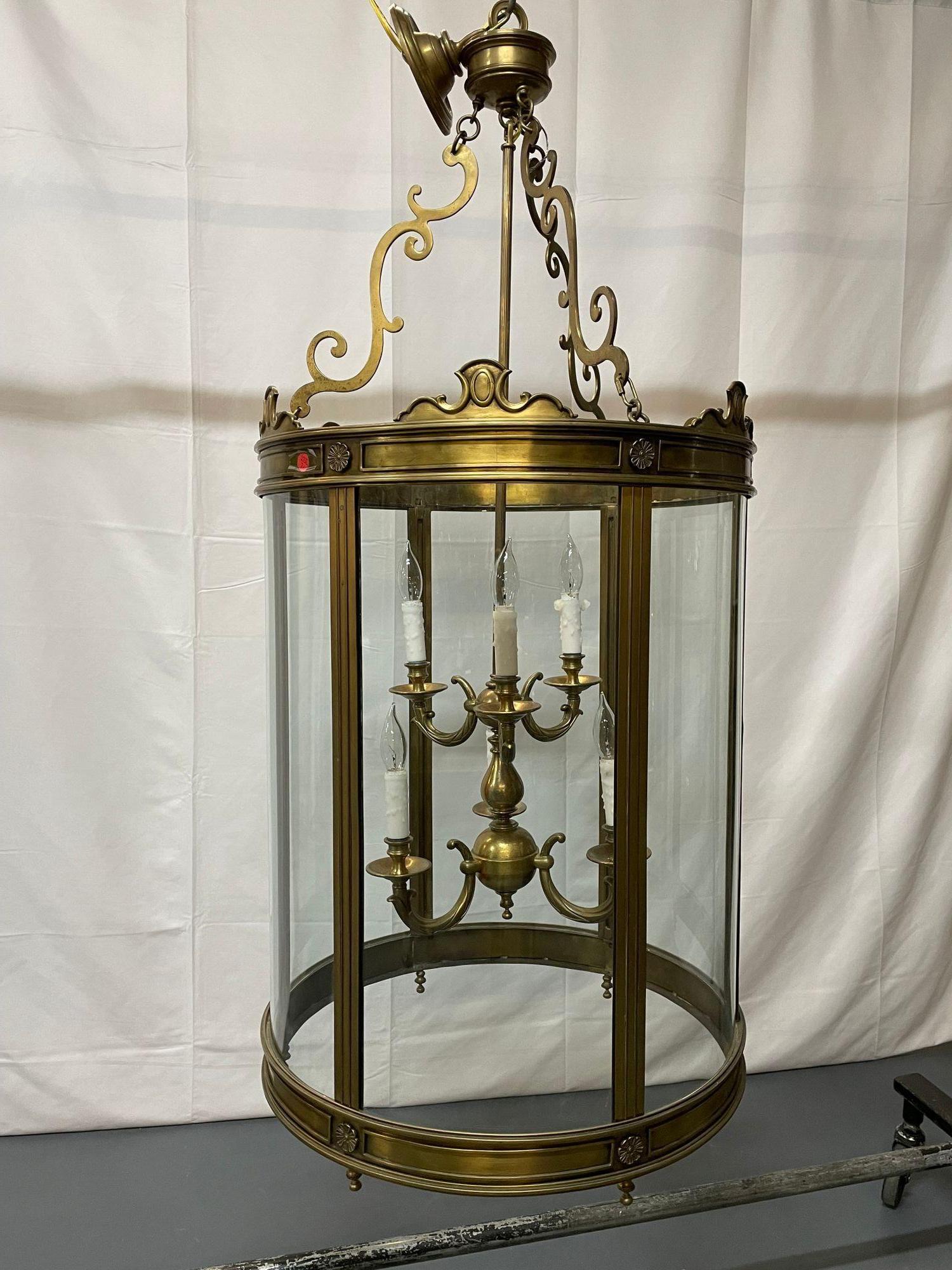 A 19th/Early 20th Century Solid Bronze Gothic Lantern, Six Lights. Circular
 
Having fine bronze escutcheons This large and impressive lantern is simply stunning. The circular all glass frame suspended by a group of three bronze S shaped supports