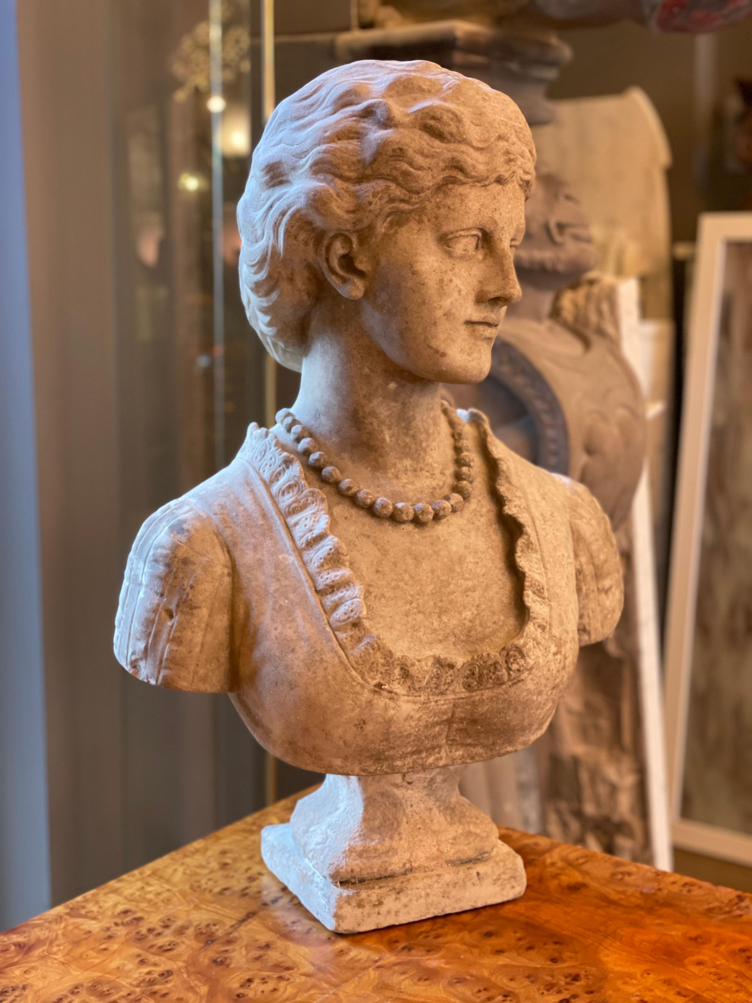 A weathered white marble bust of a female on a plinth, signed Garland on the base 

English circa 1880 

Henry Garland Royal Academy.