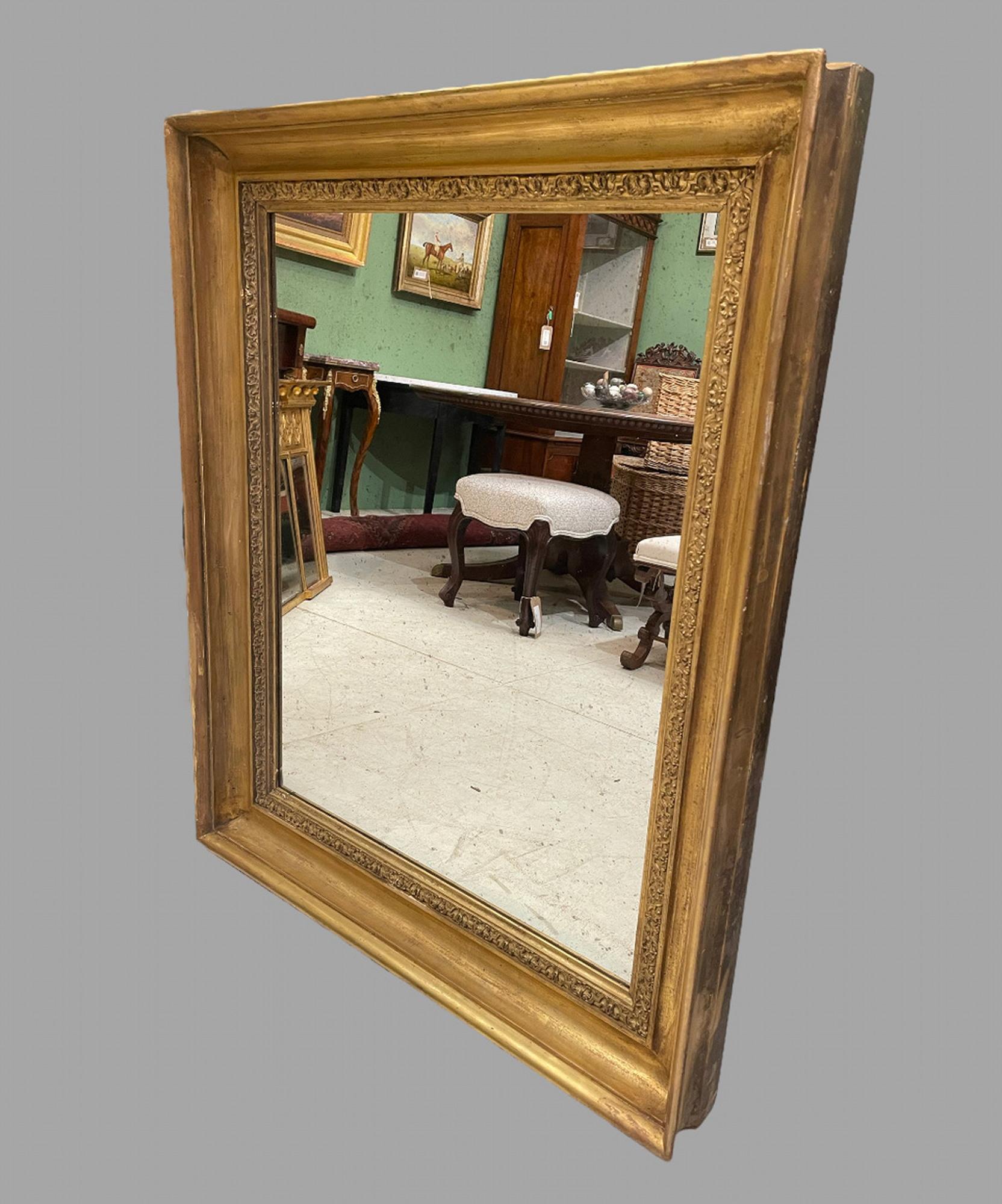 A Good Sized 19th Century Wall or Over Mantle Mirror that has a later antique mirror plate