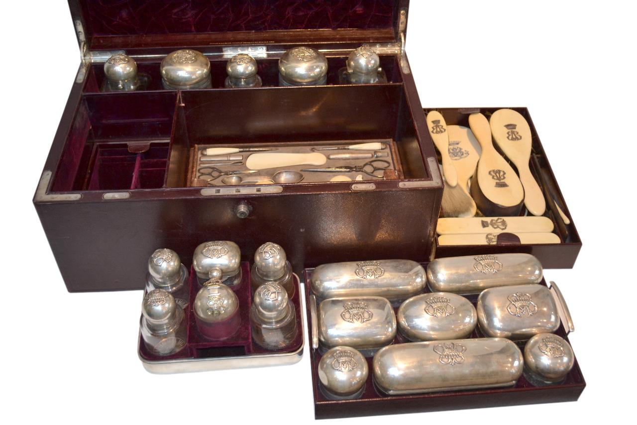 An exceptional and rare leather covered wooden case the top with the embossed silver family initials BAB in monogram under a nine pointed crown cartouche; the case is lined with crimson silk velvet and leather; the extraordinary large number of