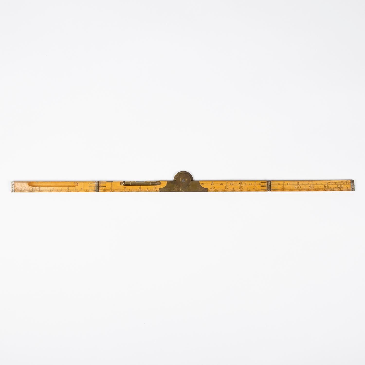 A two foot four fold boxwood rule by Edward Preston & Sons of Birmingham, circa 1880.

With central brass protractor joint, spirit level, and steel tips.

Numbered: 3111L

With 