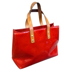 A 2004 Louis Vuitton Red Vernis Patent Leather and Vachetta Reade Hand-Bag